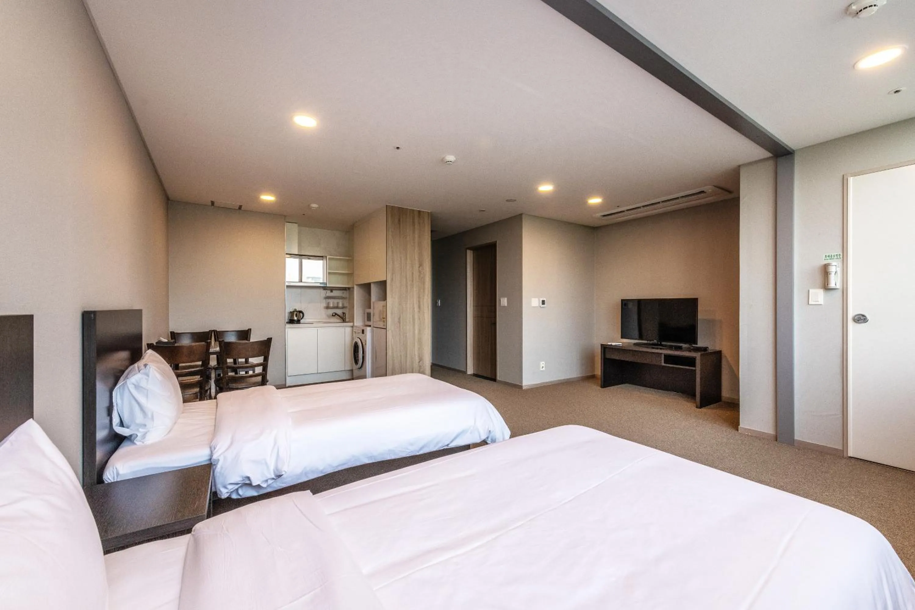 Bed in The Triny Urban Suites