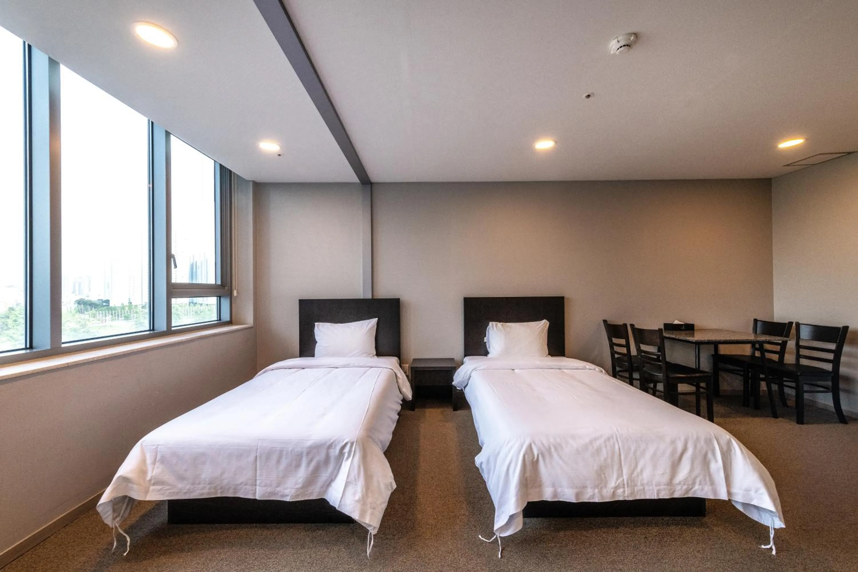 Bed in The Triny Urban Suites