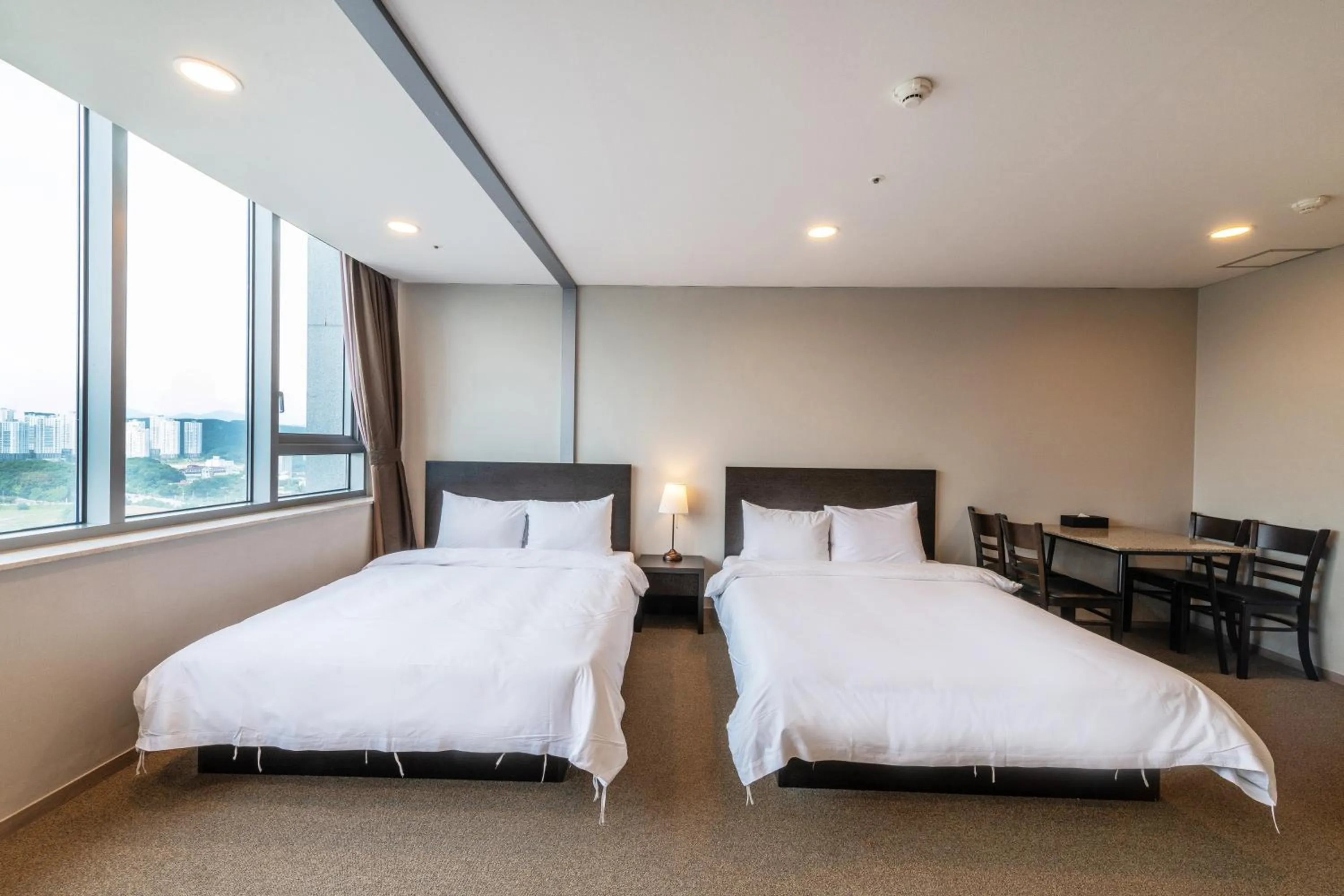 Bed in The Triny Urban Suites