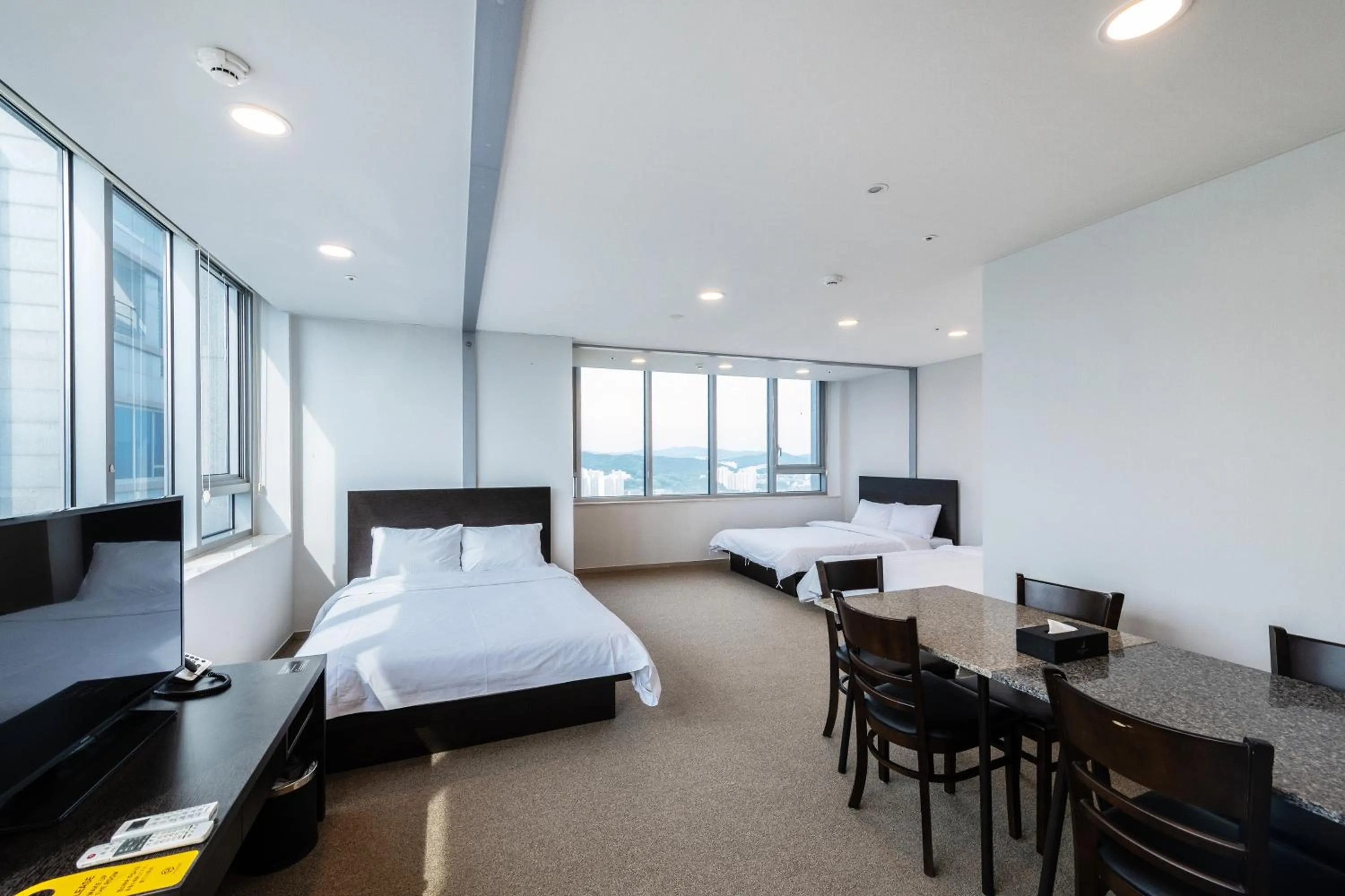 Bed in The Triny Urban Suites