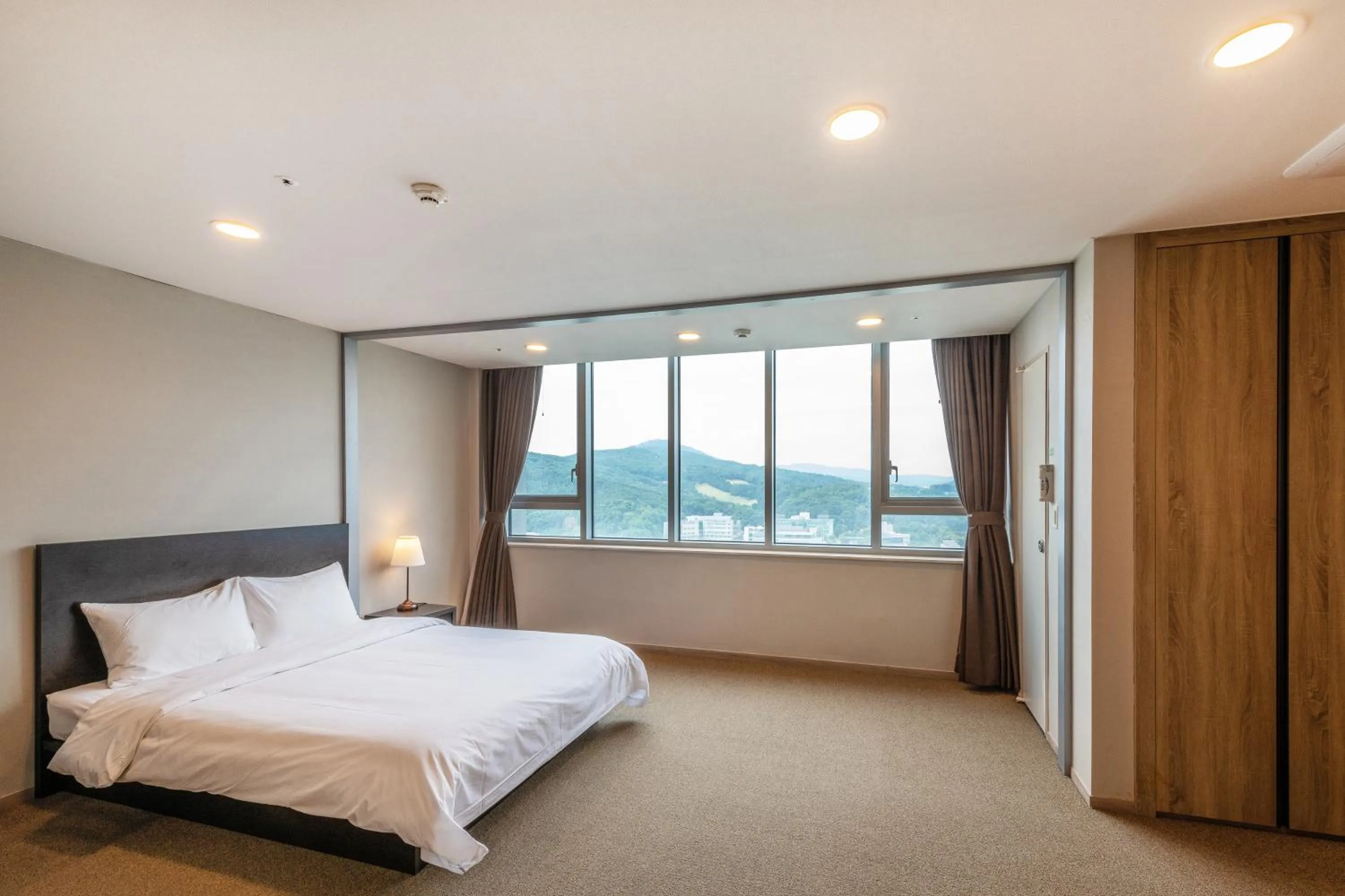 Bed in The Triny Urban Suites