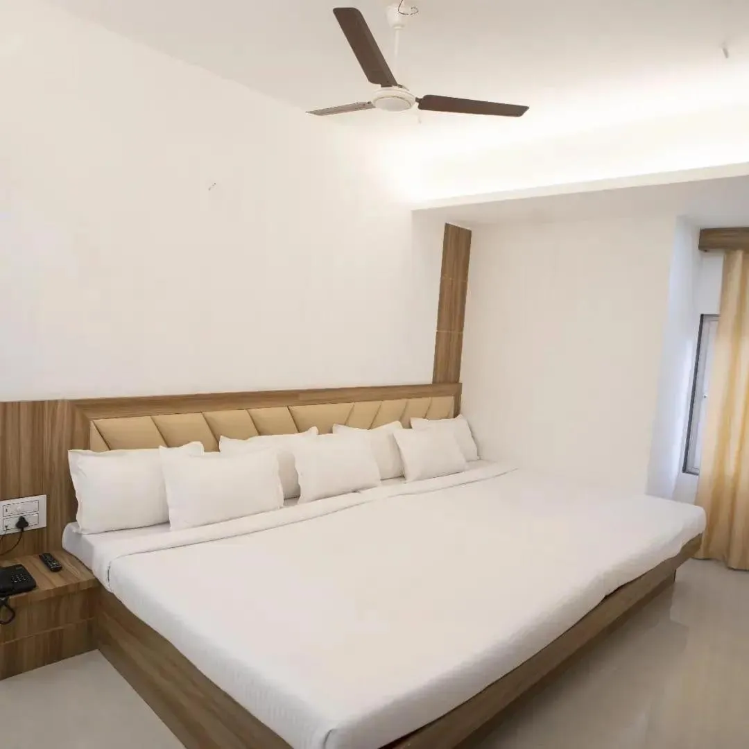 Bed in Hotel Shanti International