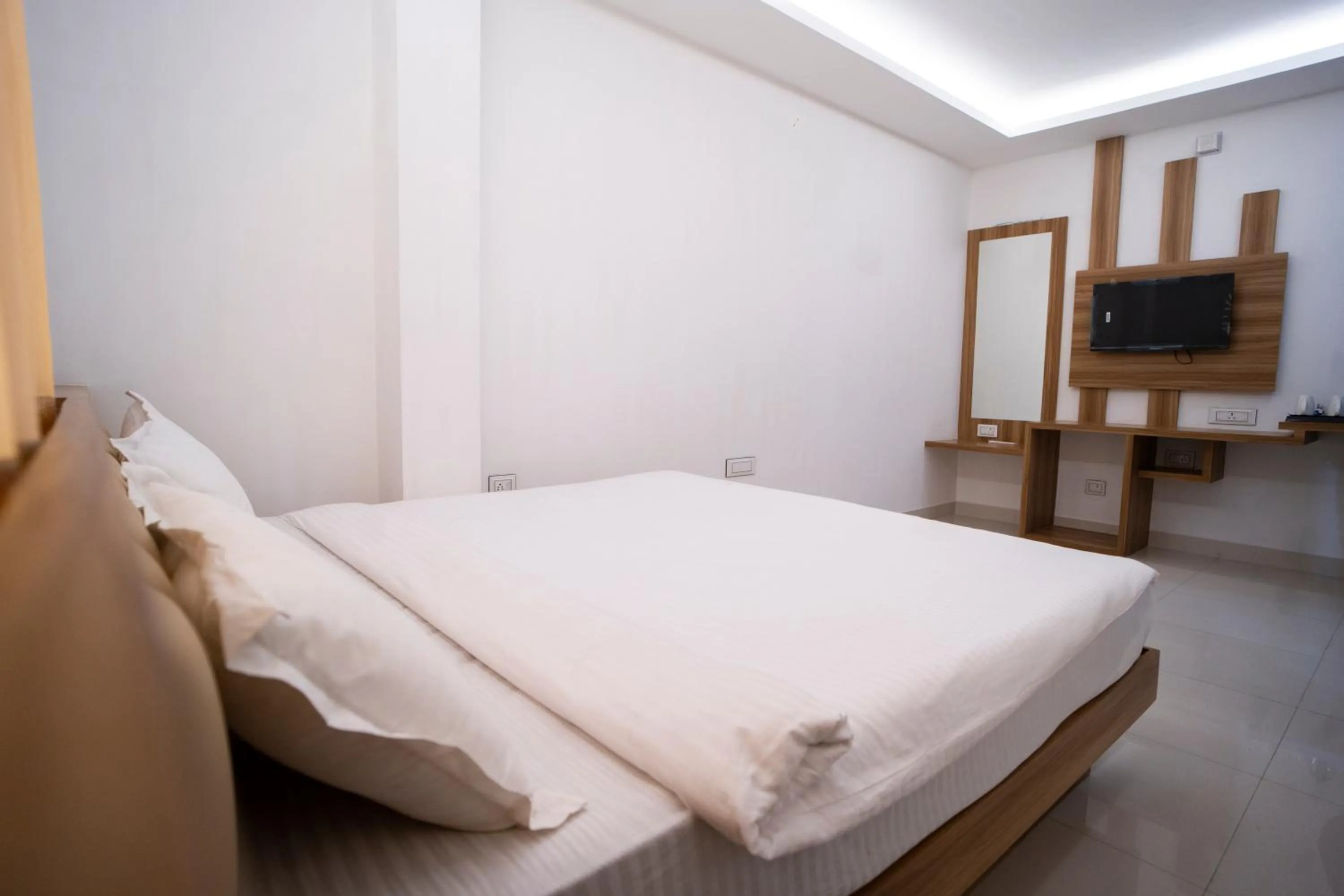 Bed in Hotel Shanti International