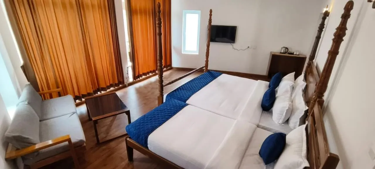 Communal lounge/ TV room, Bed in COASTAL GRAND RESORT - KOTAGIRI