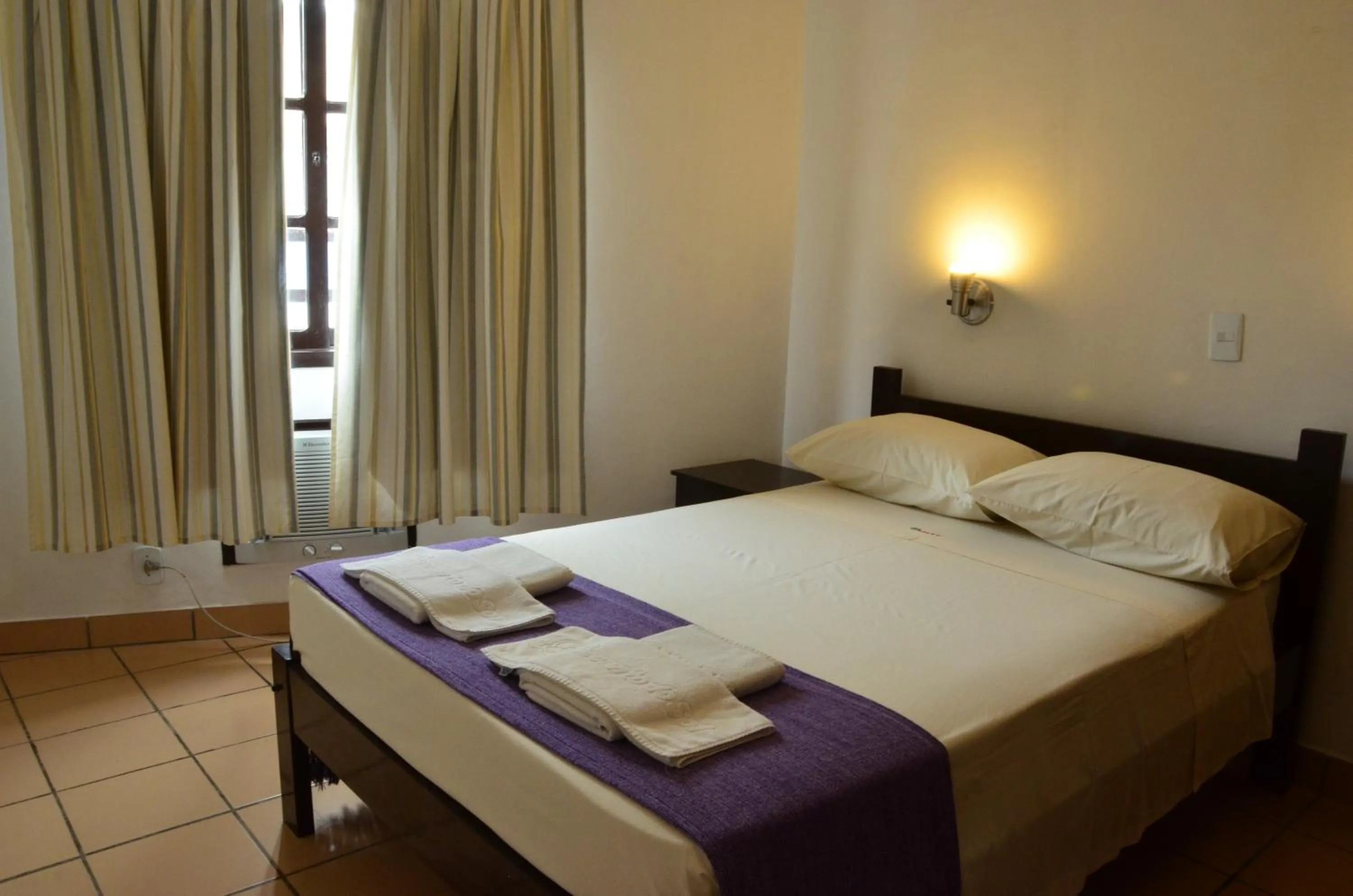 Bed in Residencial Vila do Sol, Apartamentos com pé na areia