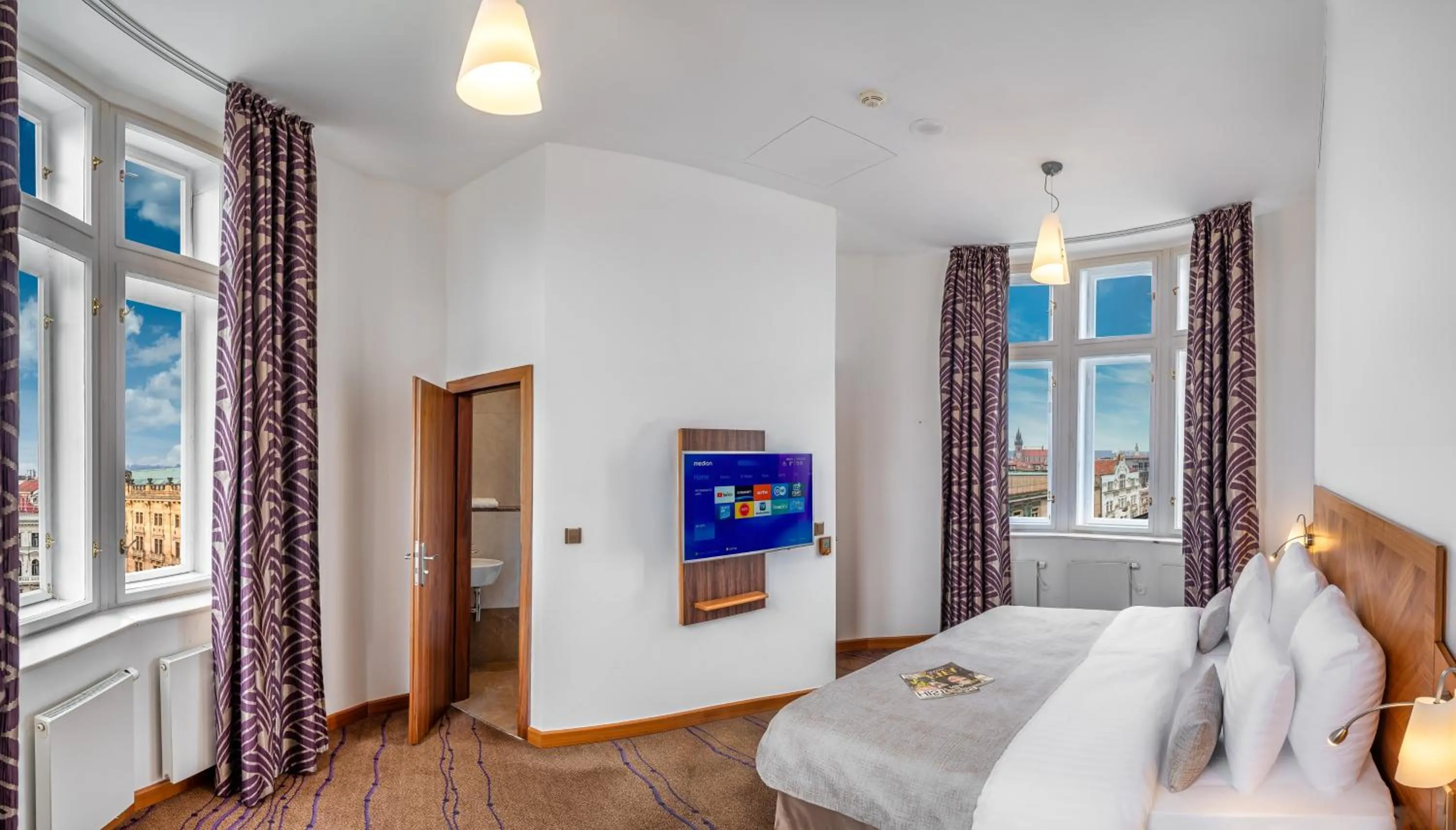 Bed in Crown Palace Apartments by Adrez