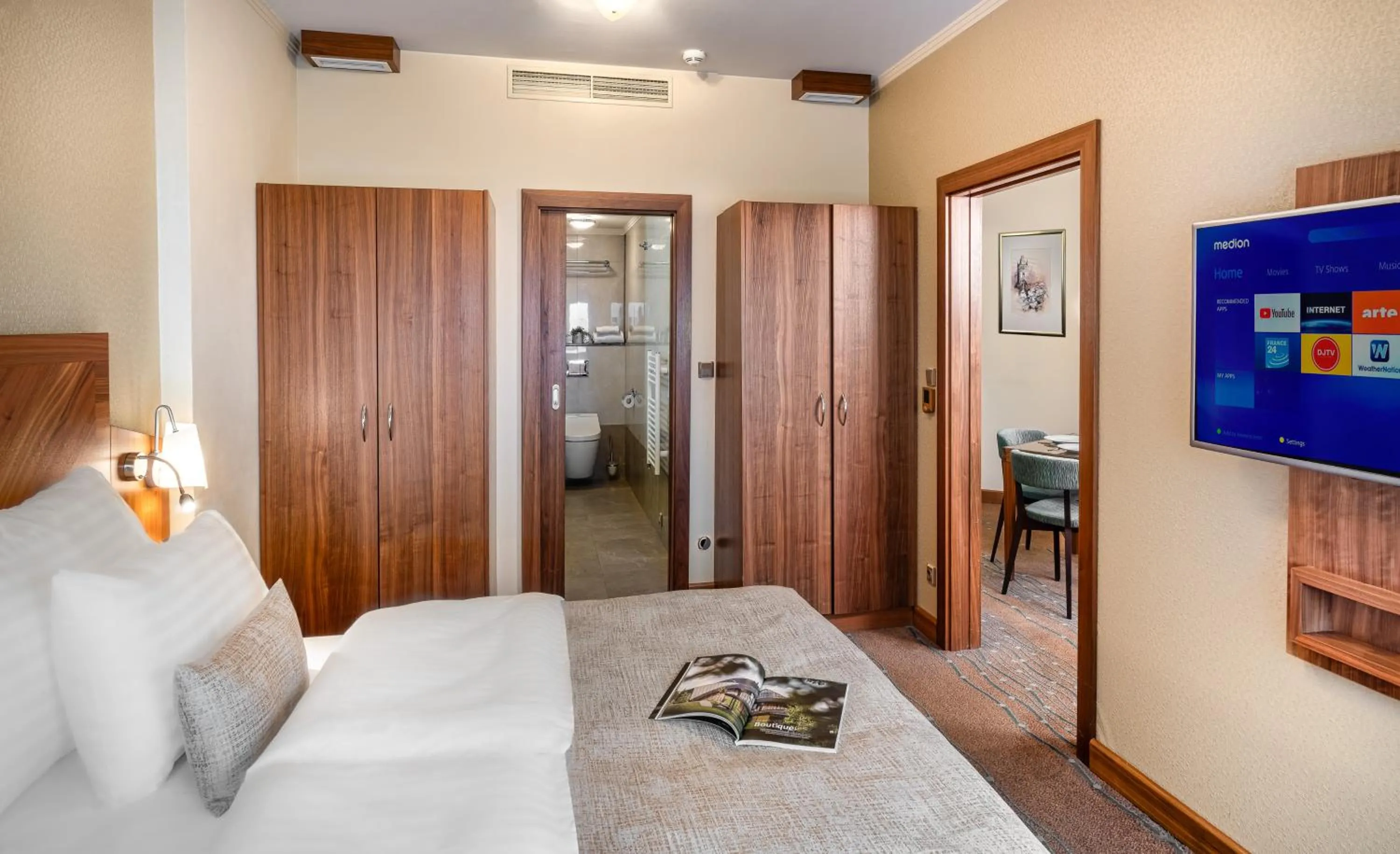 Bed in Crown Palace Apartments by Adrez