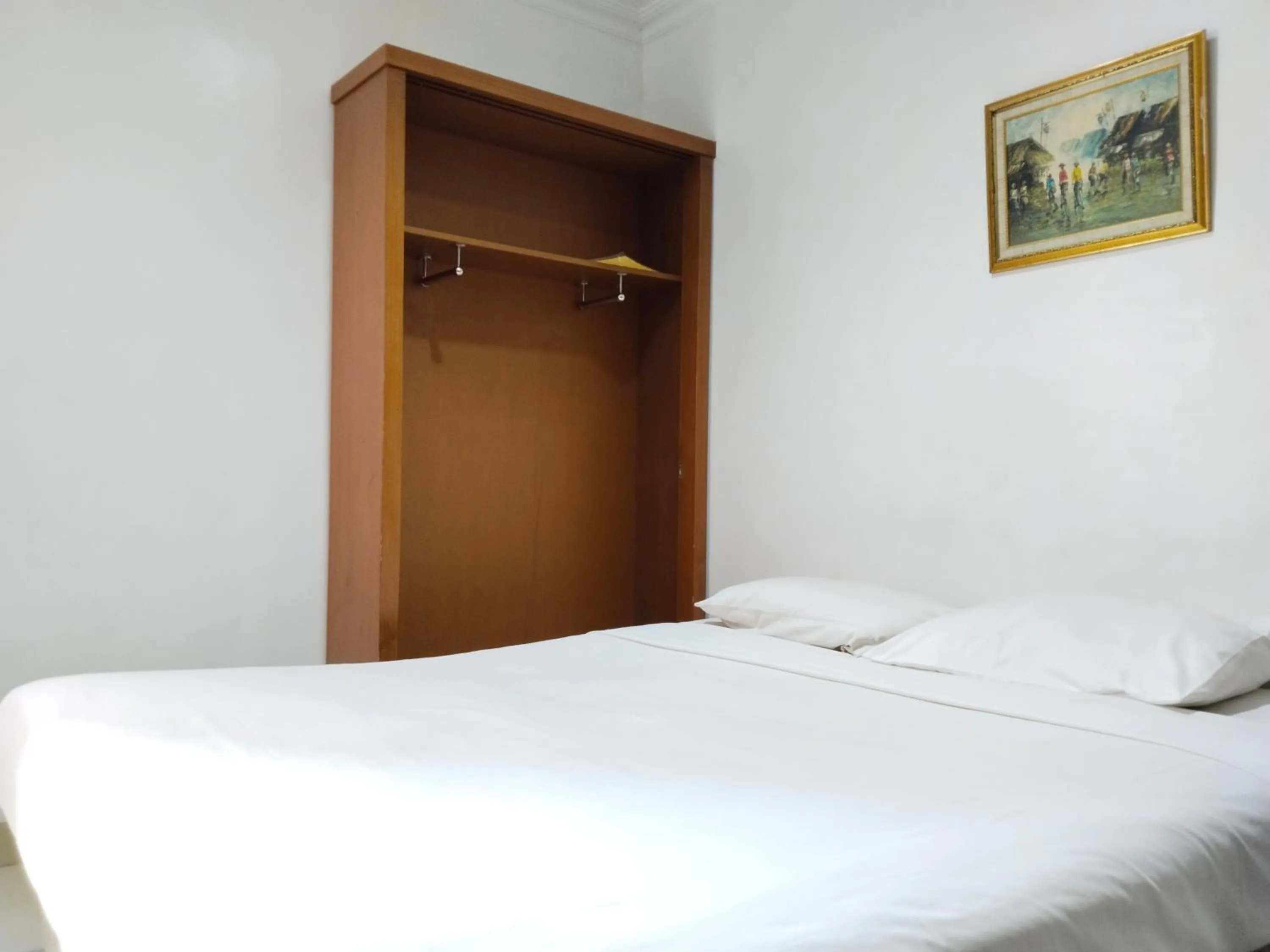 Bed in Metro Hotel Bekasi powered by Cocotel