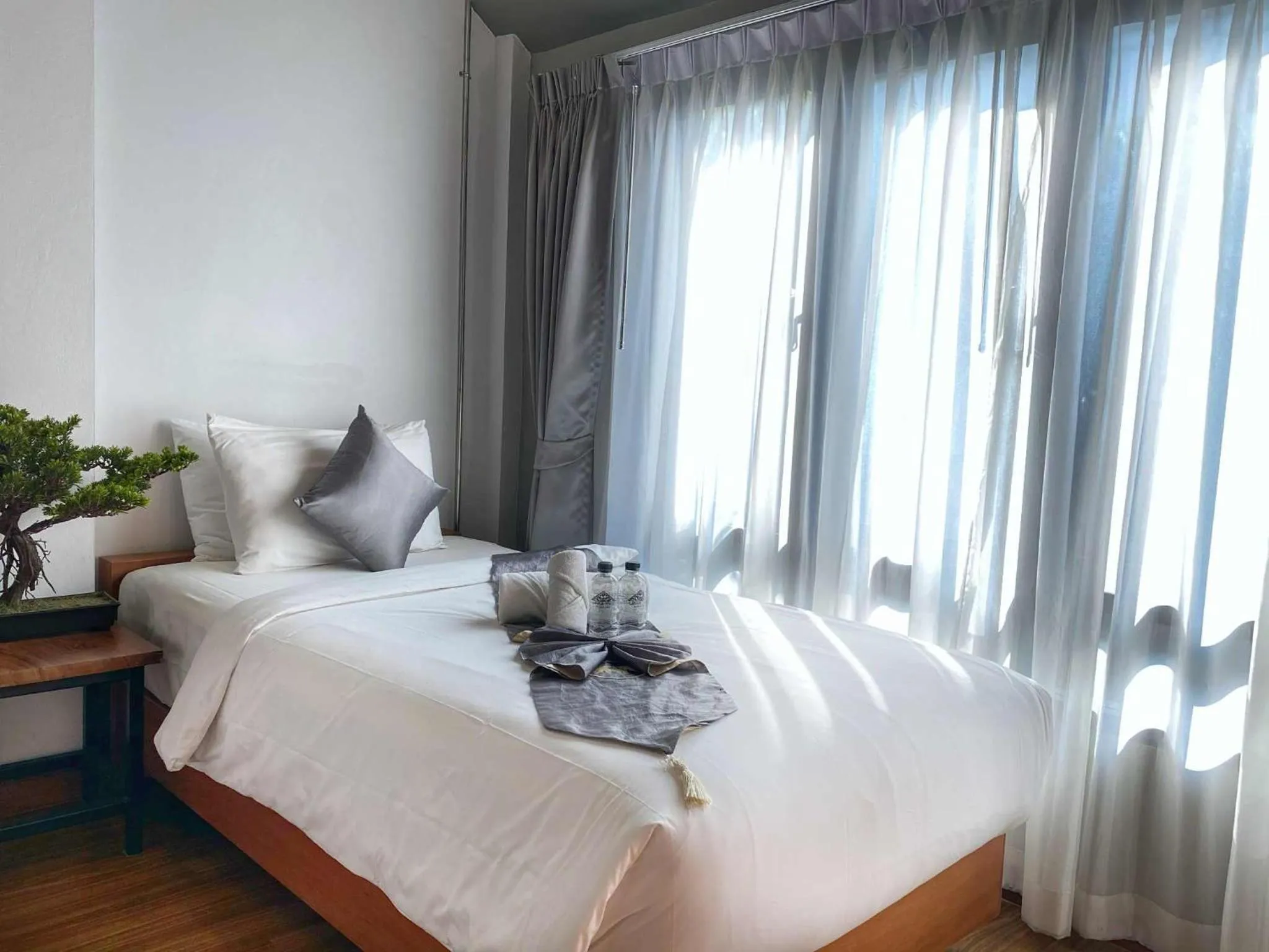 Bed in Lanna Tree Boutique Hotel