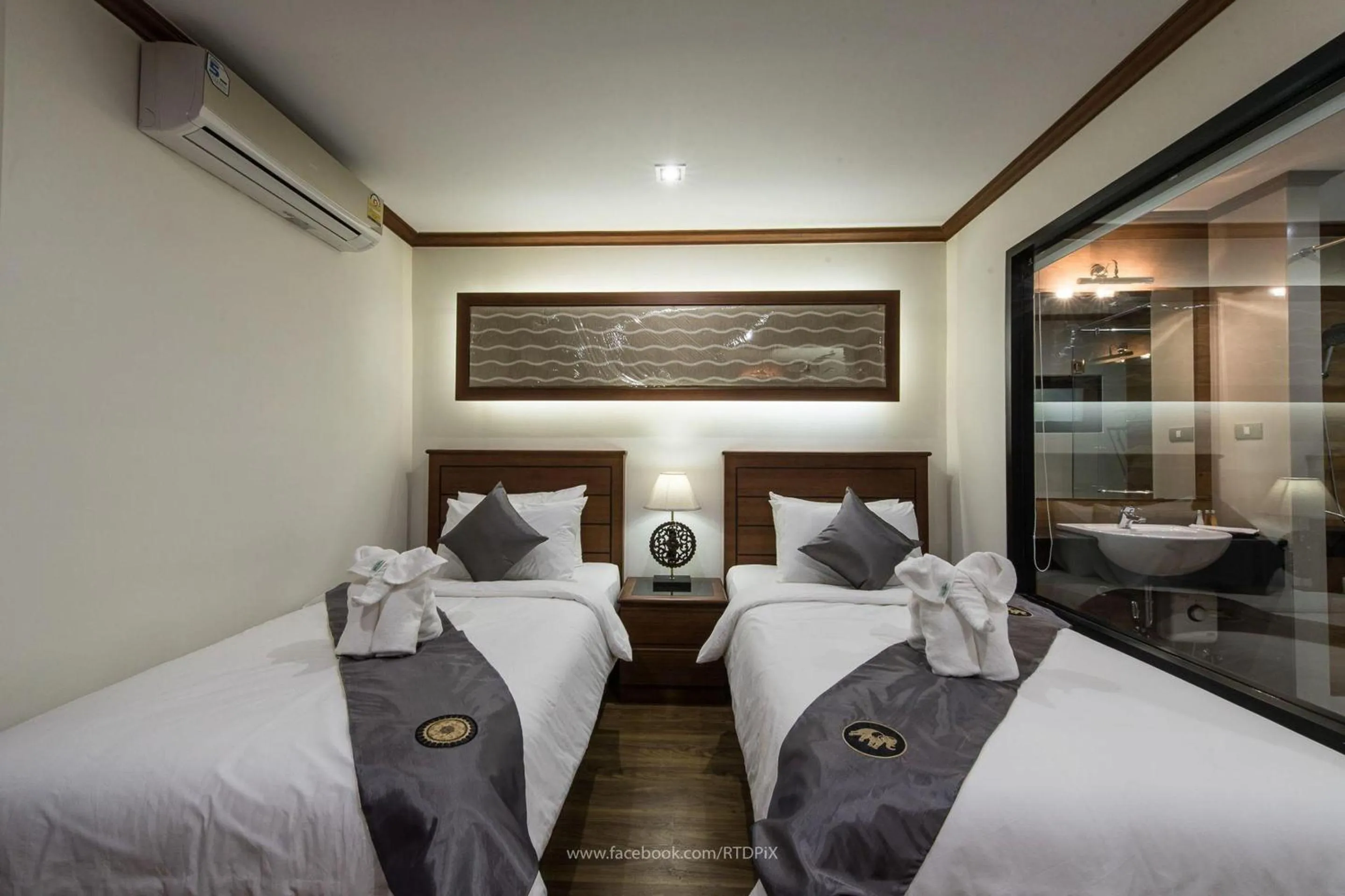 Bed in Lanna Tree Boutique Hotel