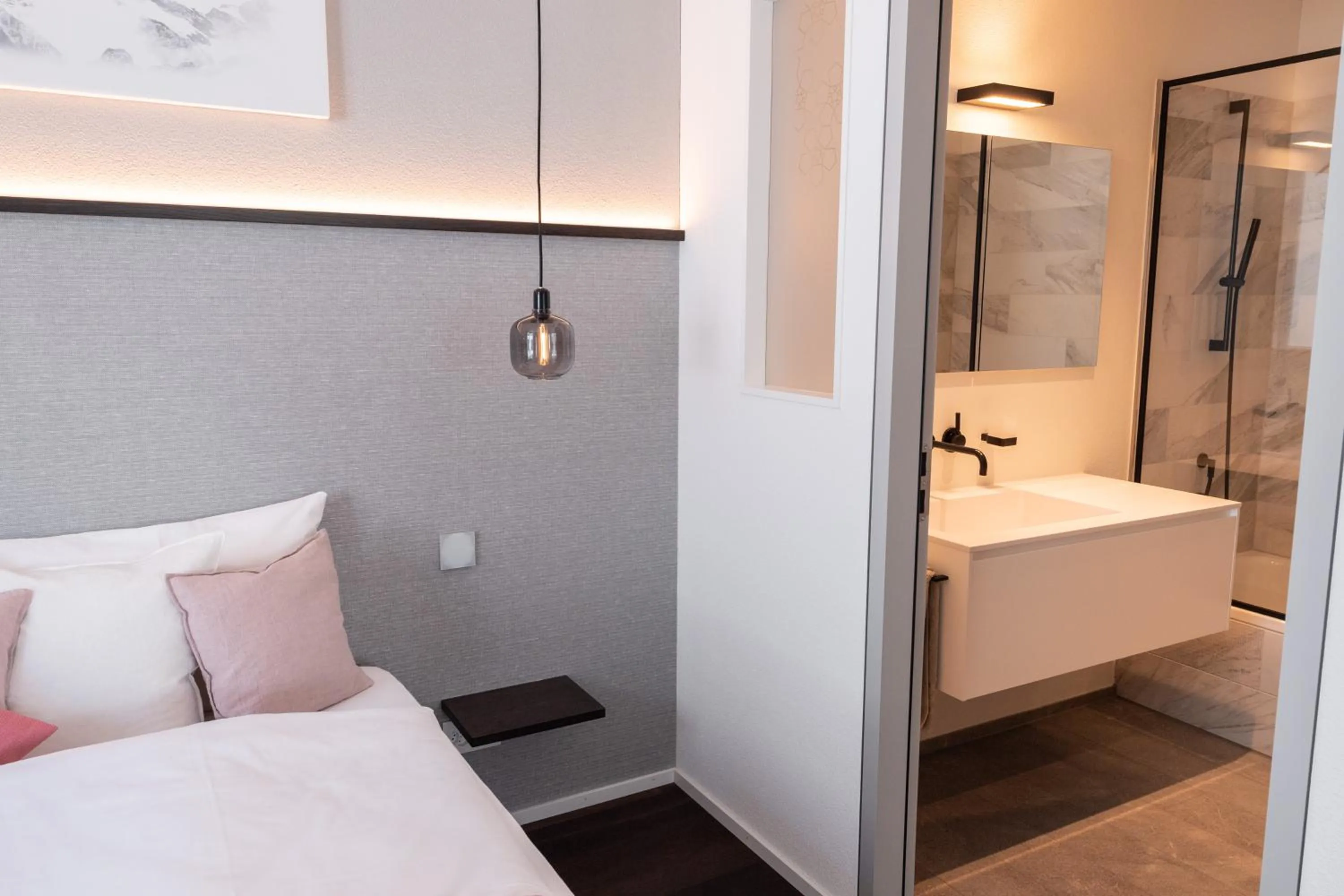 Bathroom, Bed in Andermatt Alpine Apartments