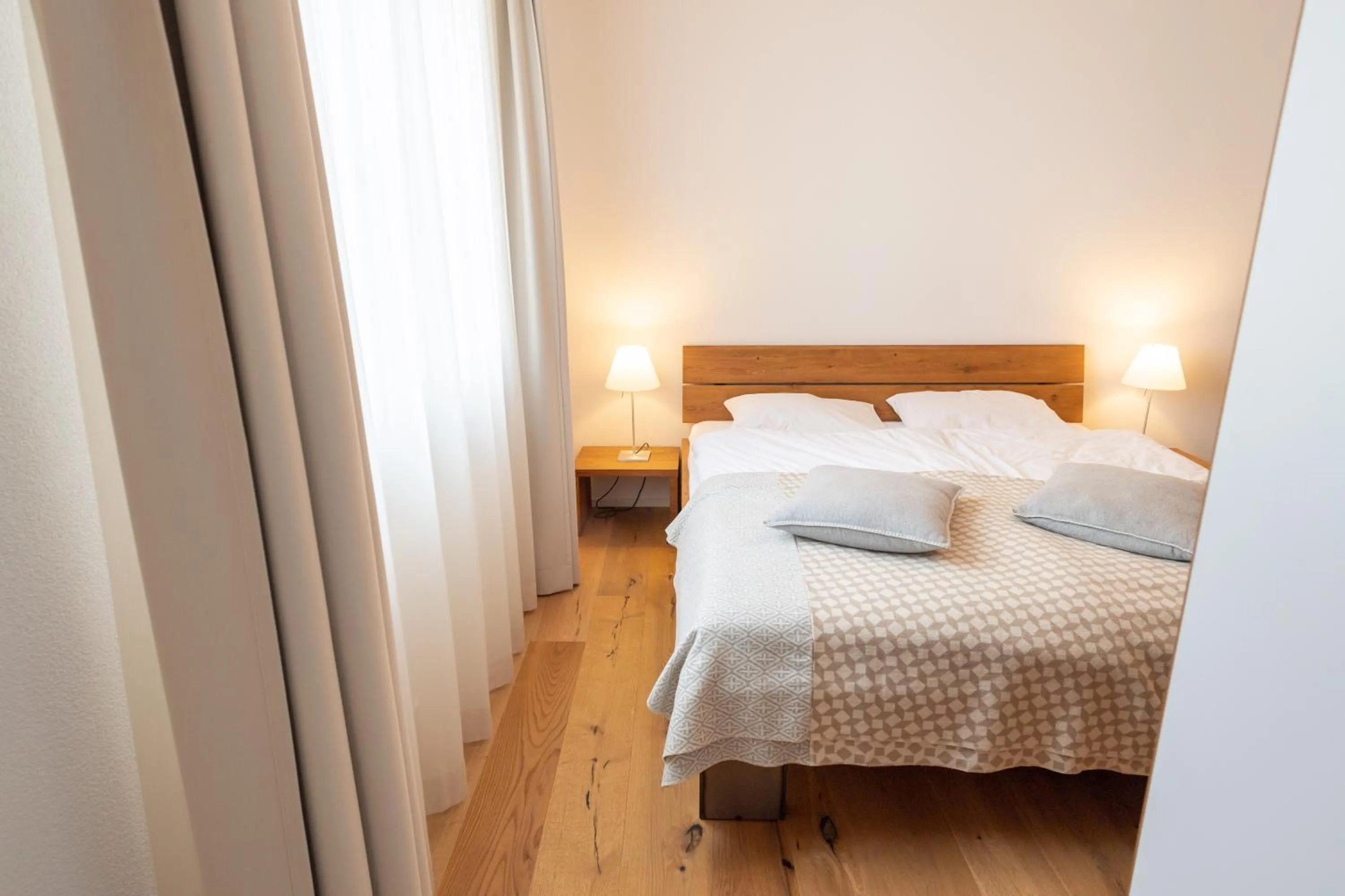 Bedroom, Bed in Andermatt Alpine Apartments