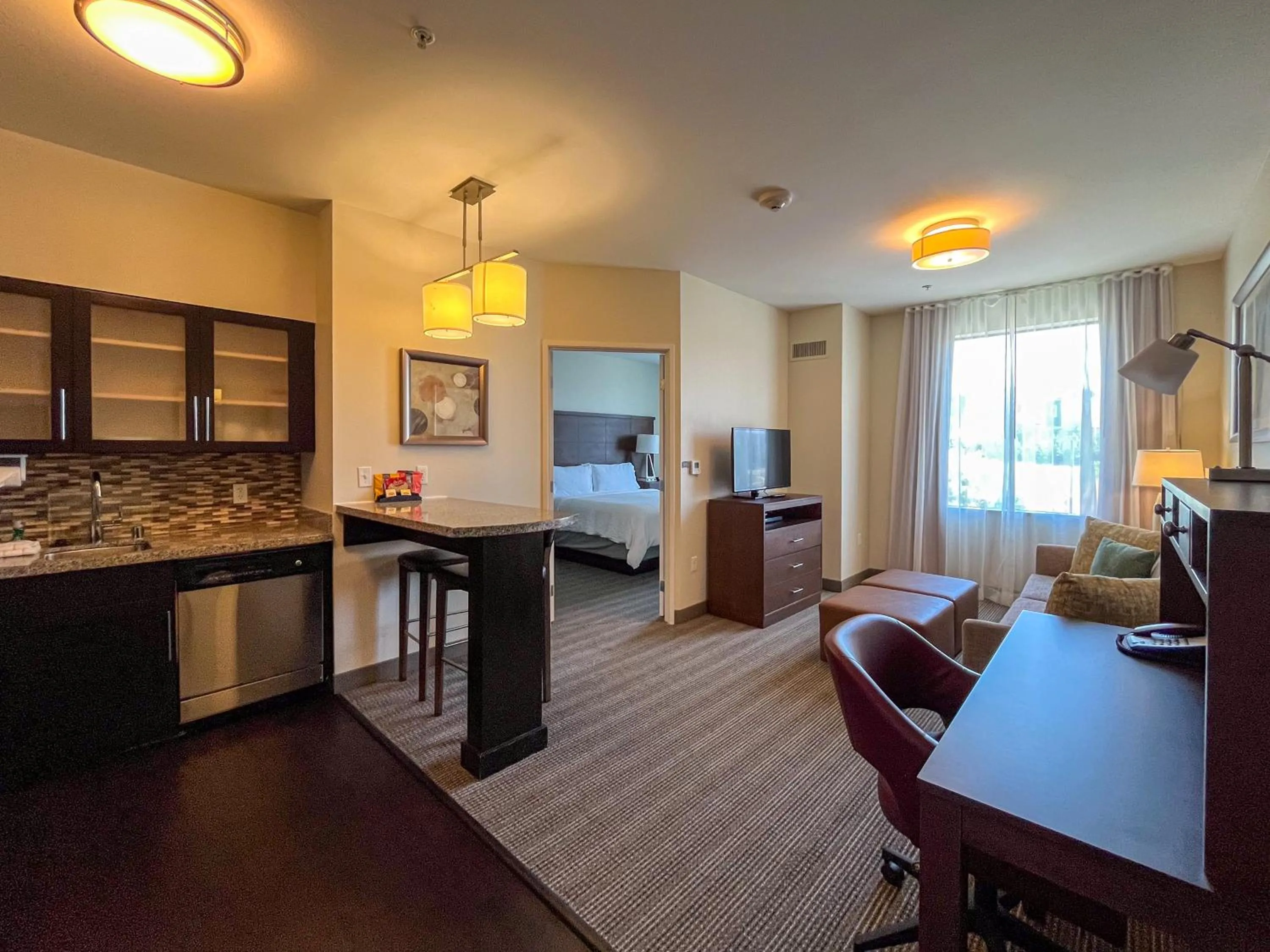 Seating area, Bed in Staybridge Suites Carlsbad/San Diego by IHG