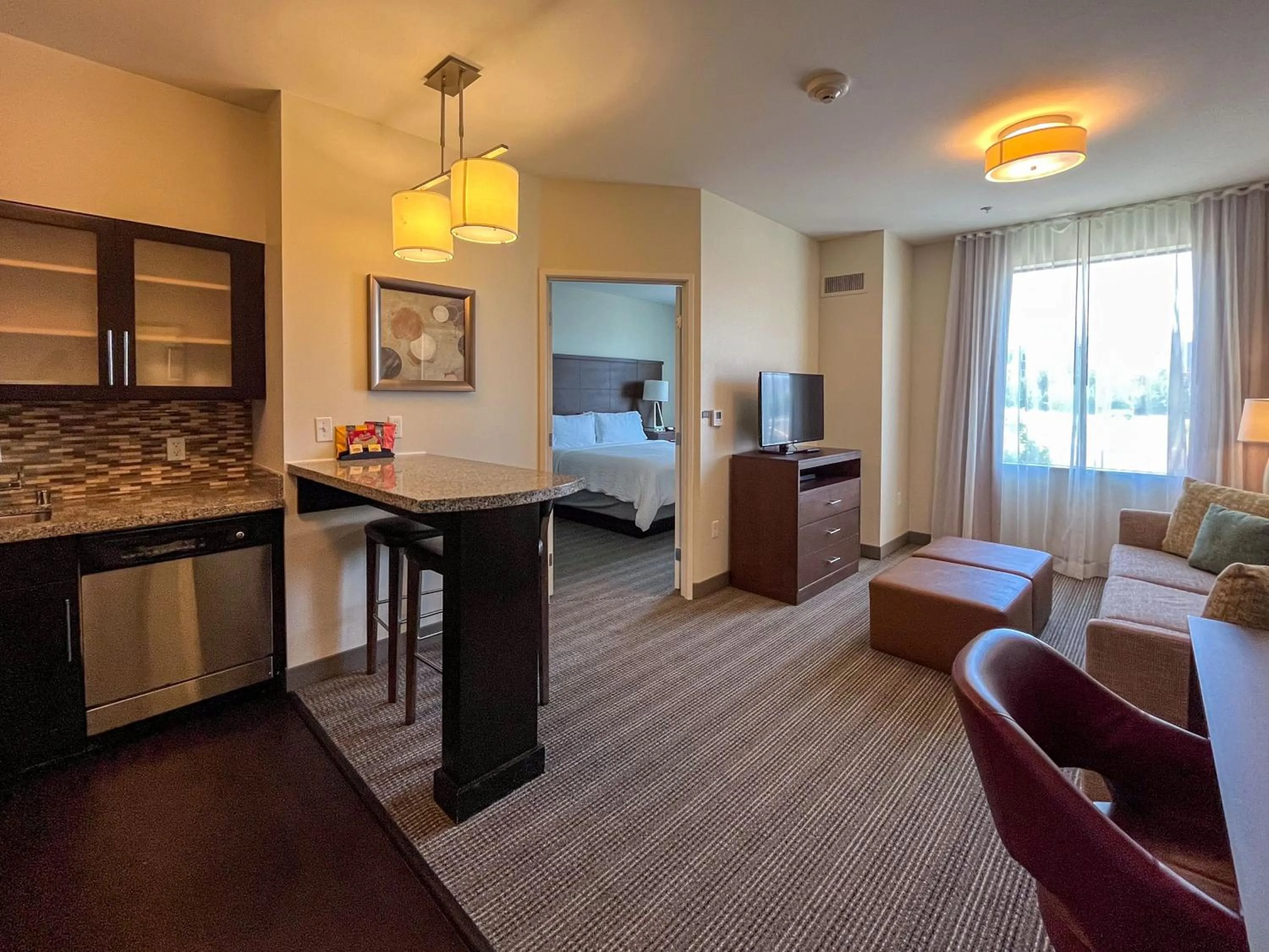Seating area, Bed in Staybridge Suites Carlsbad/San Diego by IHG