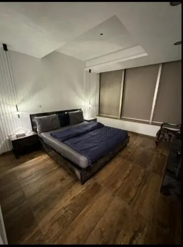 Photo of the whole room, Bed in The Centaurus Apartments