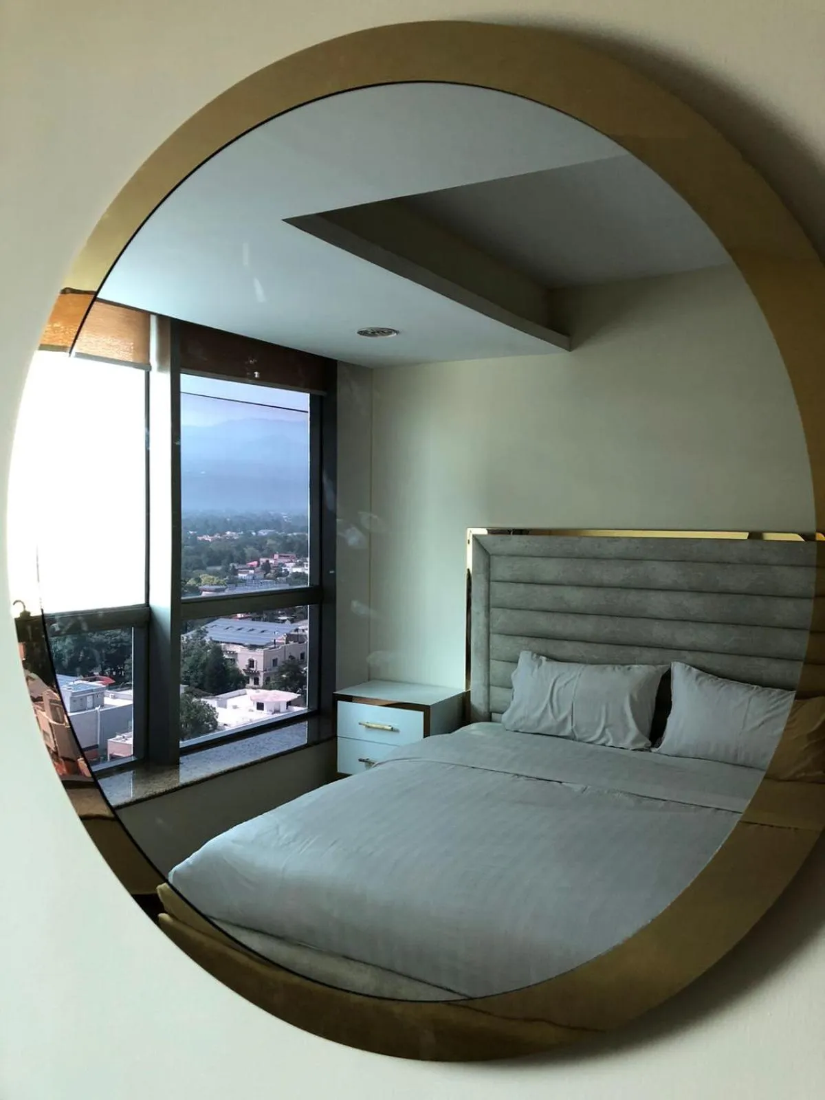 Photo of the whole room, Bed in The Centaurus Apartments