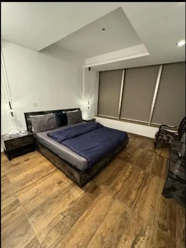 Bed in The Centaurus Apartments