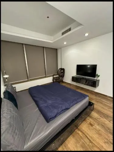Bed in The Centaurus Apartments