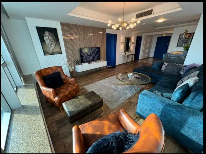 Communal lounge/ TV room in The Centaurus Apartments