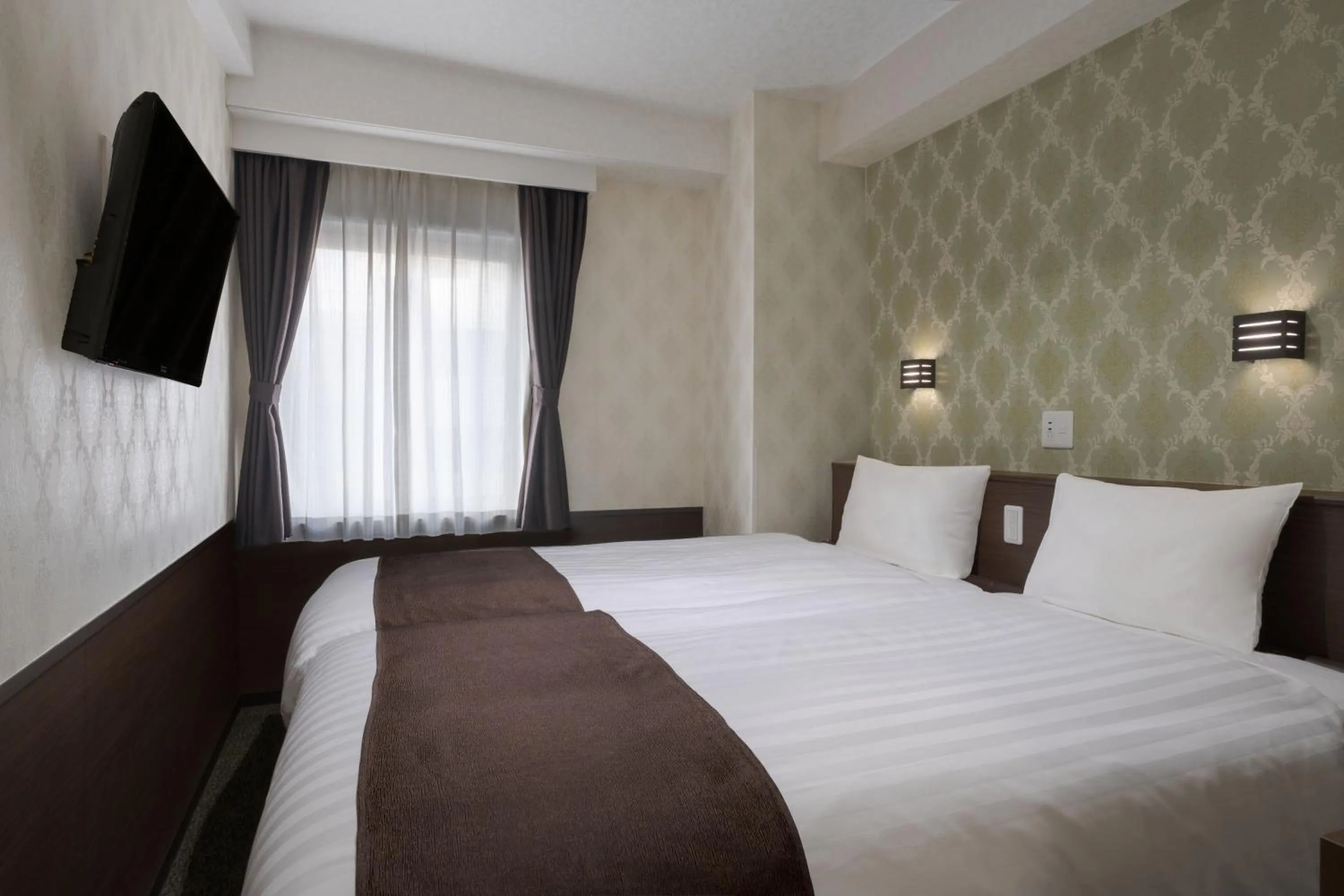 Bed in Hotel Centmain Nagoya