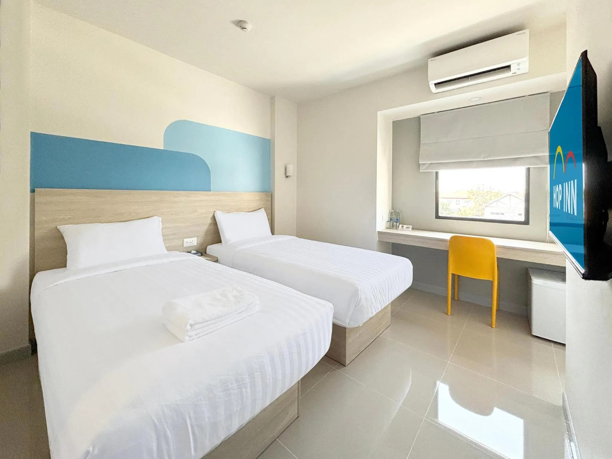 Bed in HOP INN Suphanburi