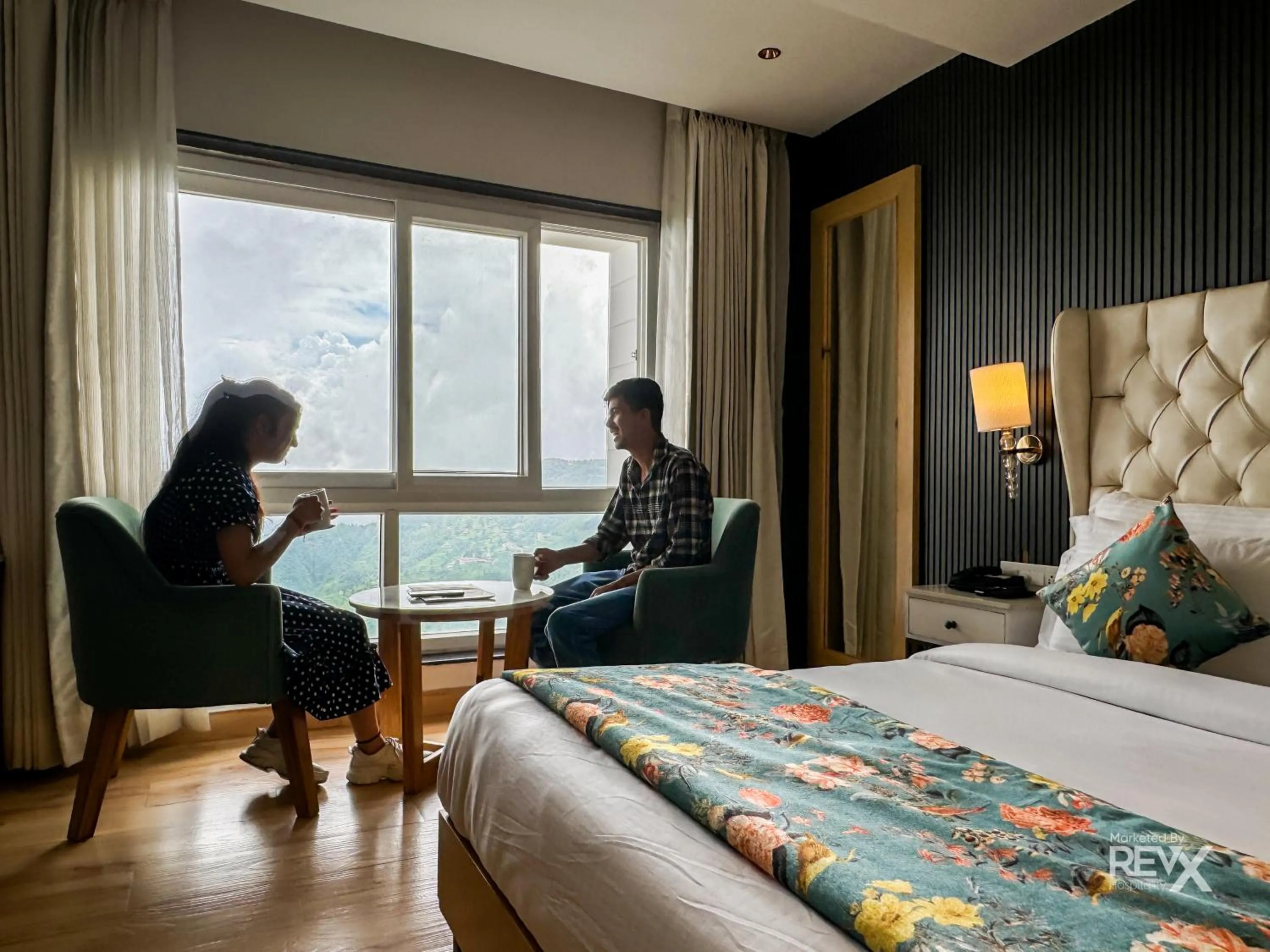 Seating area, Bed in Hotel Rockland Residency