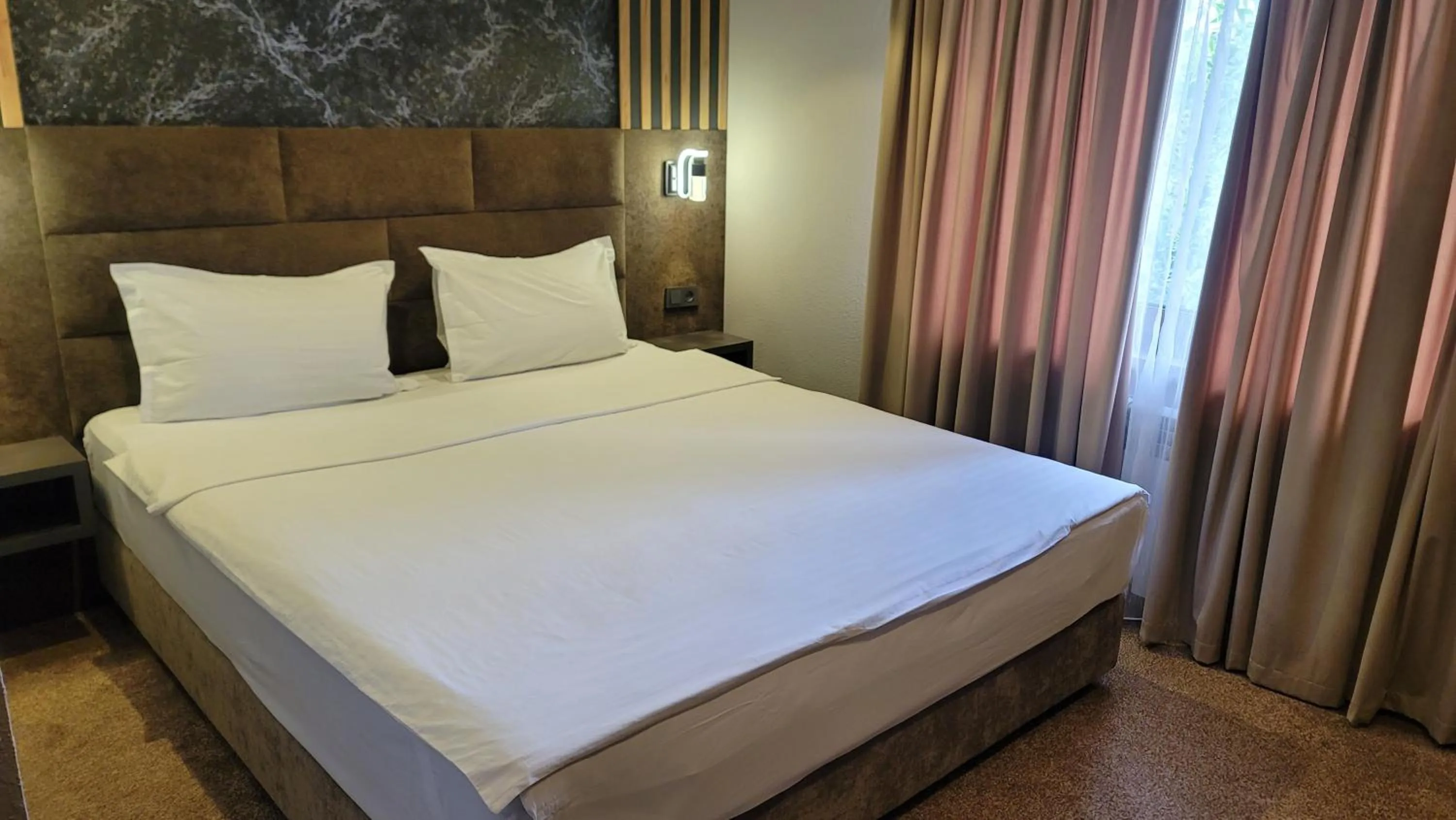 Bed in Homy House Hotel