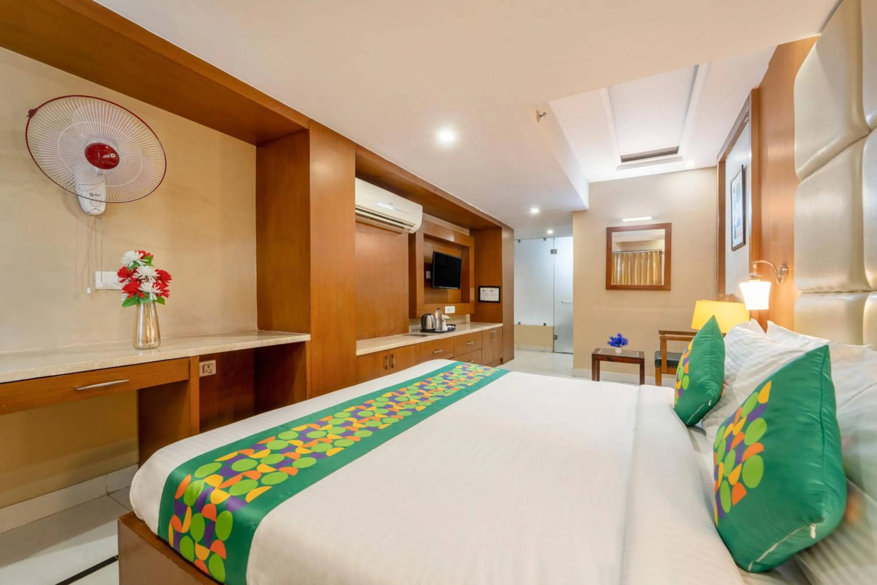 Bedroom, Bed in Treebo Premium Vinnie - Near Airport