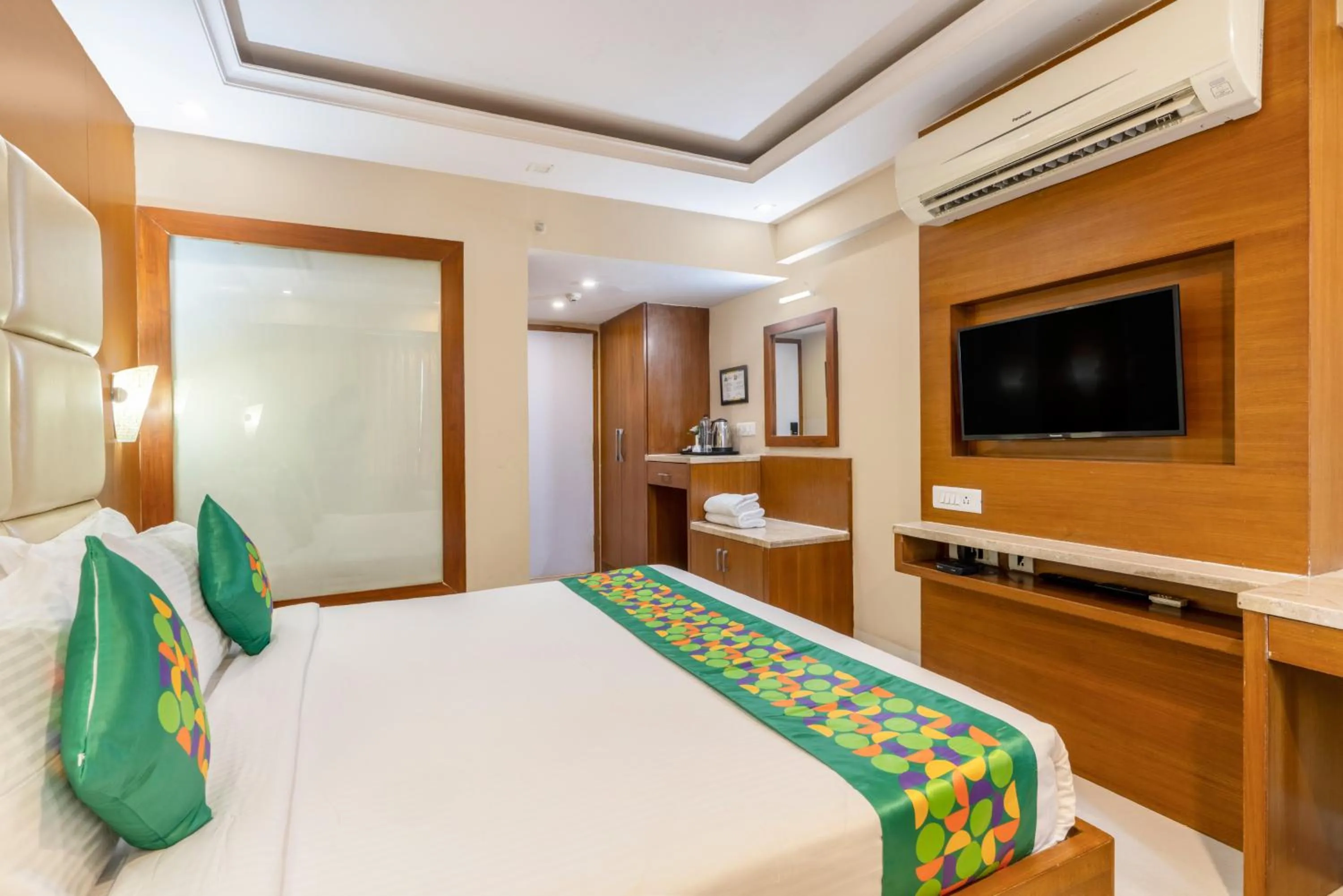 Bedroom, Bed in Treebo Premium Vinnie - Near Airport