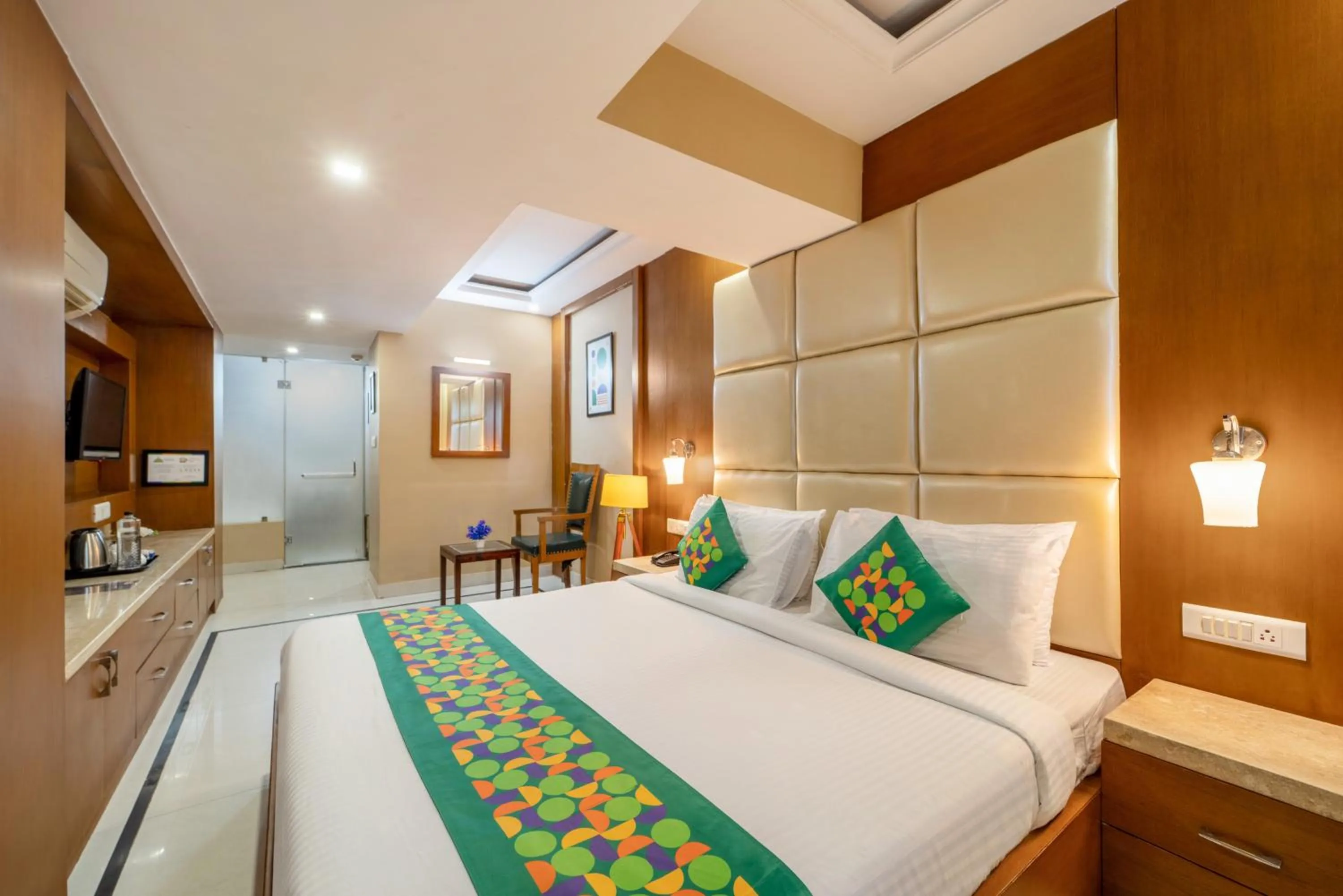 Bedroom, Bed in Treebo Premium Vinnie - Near Airport