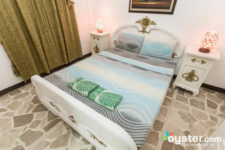 Bed in White & Yellow Castle Hotel and Resort