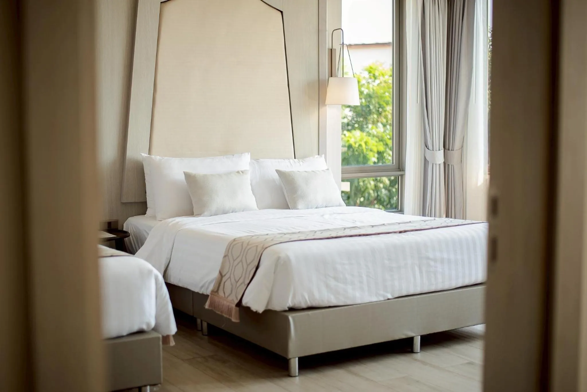 Bed in THE NAVY HOUSE HOTEL