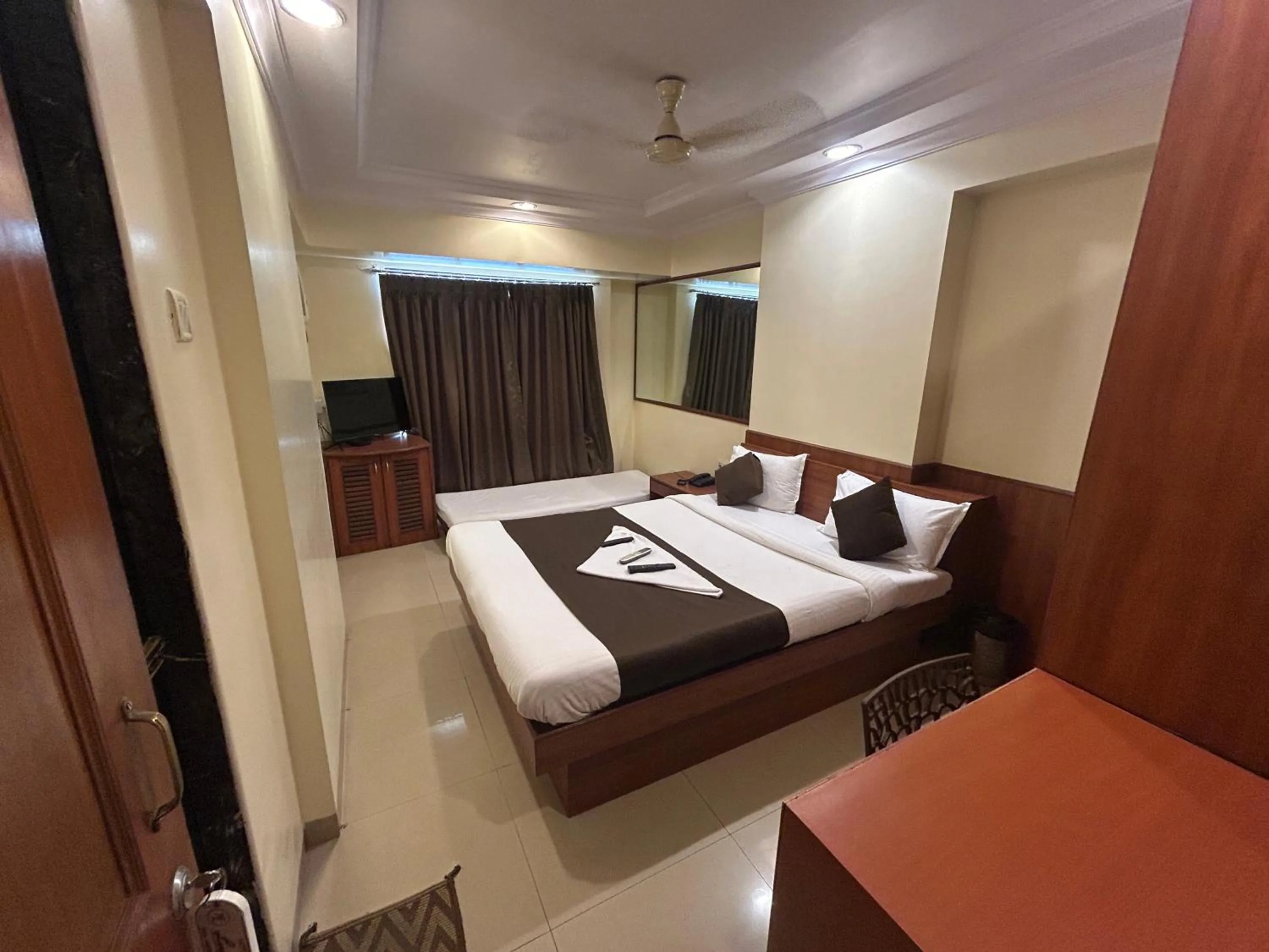 Photo of the whole room, Bed in Hotel Lucky Goregaon