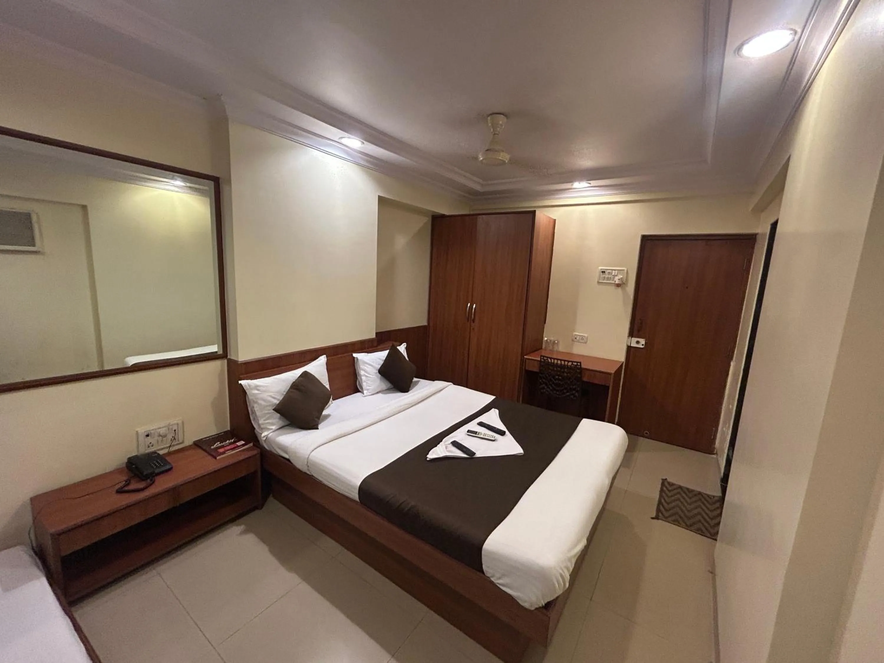 Photo of the whole room, Bed in Hotel Lucky Goregaon