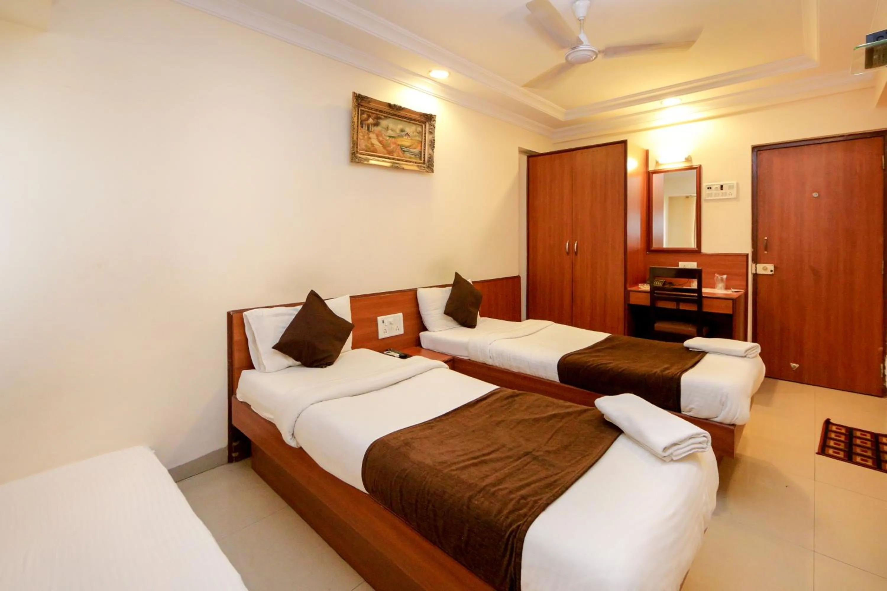 Photo of the whole room, Bed in Hotel Lucky Goregaon