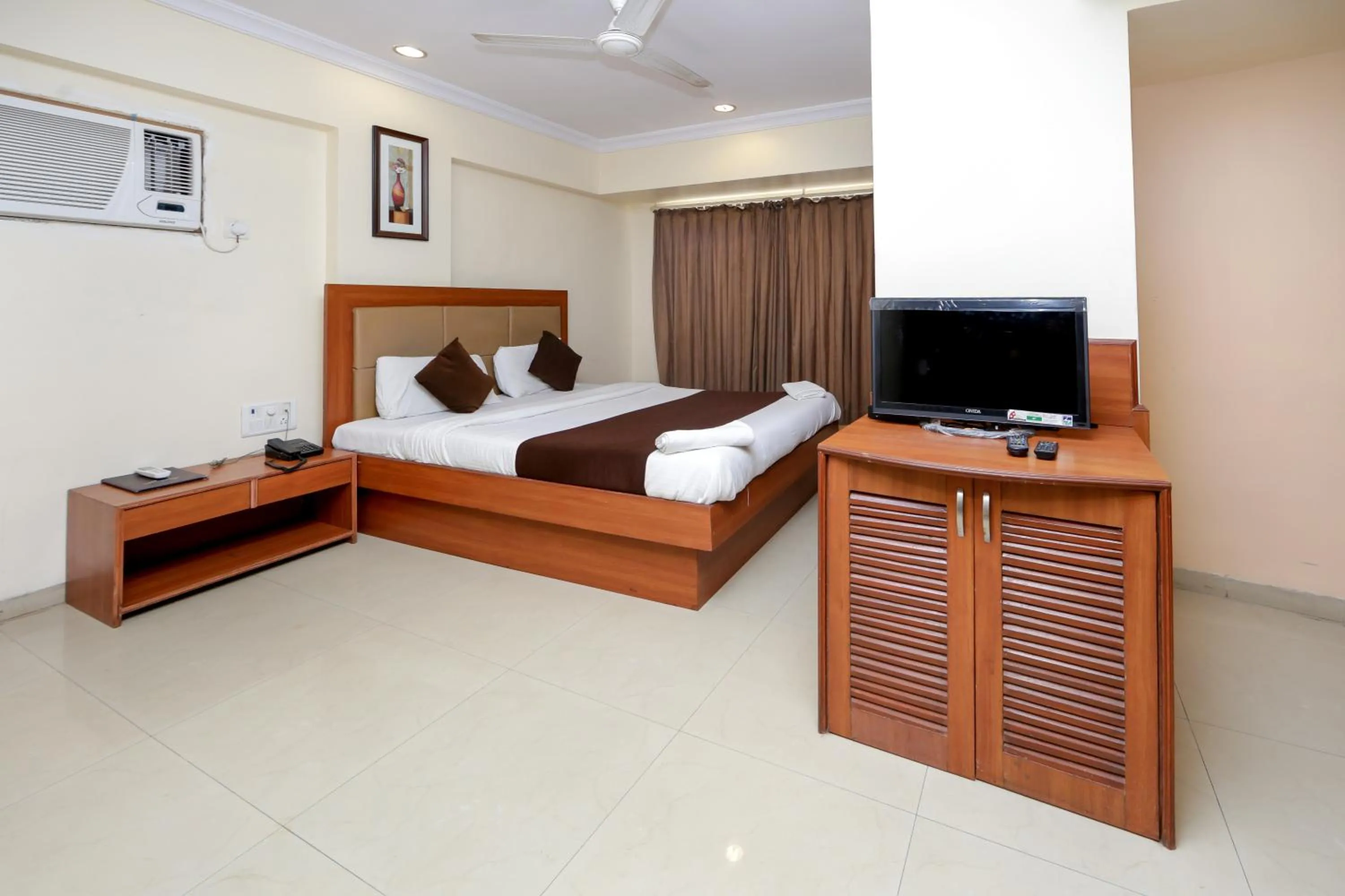 Photo of the whole room, Bed in Hotel Lucky Goregaon