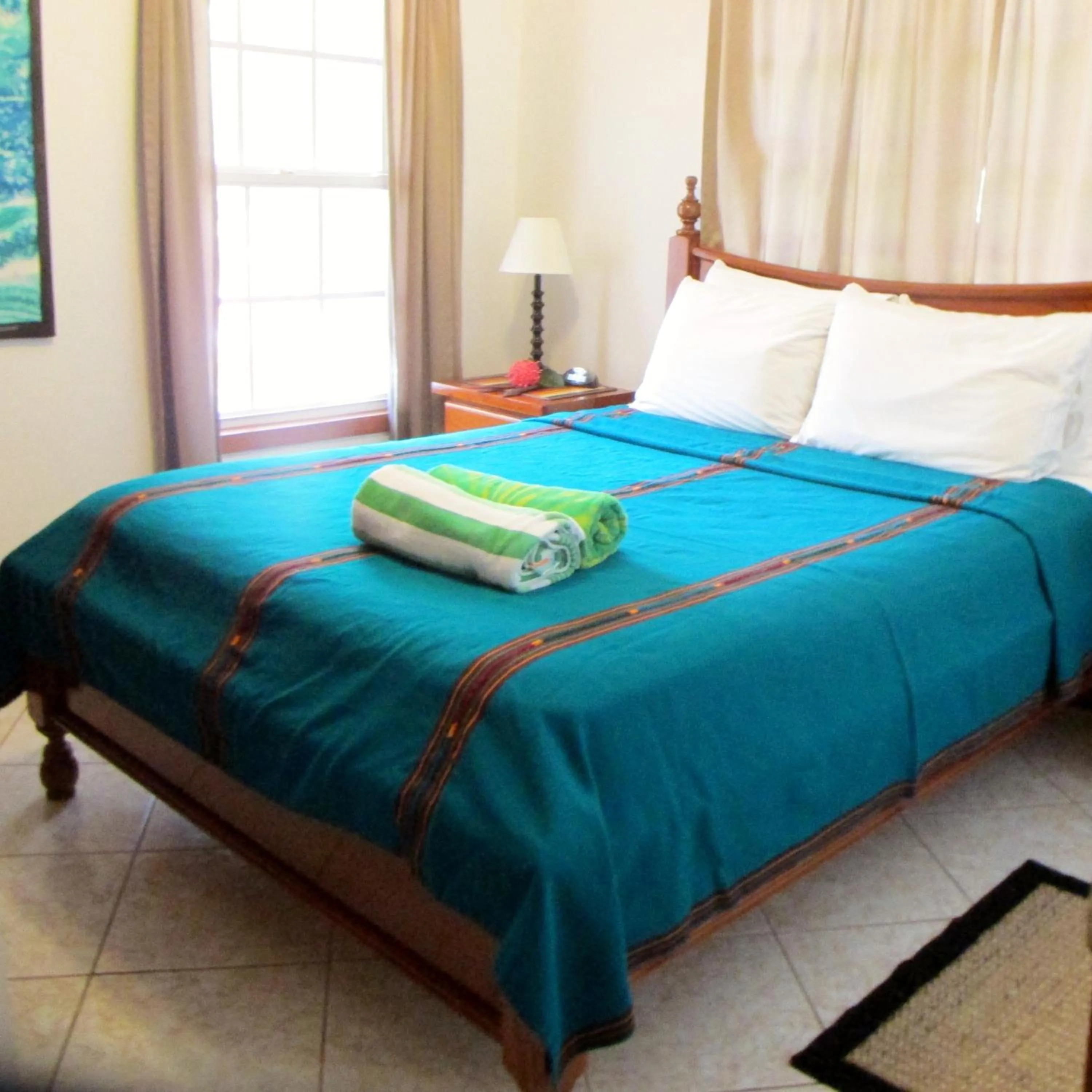 Bed in Cocotal Inn and Cabanas