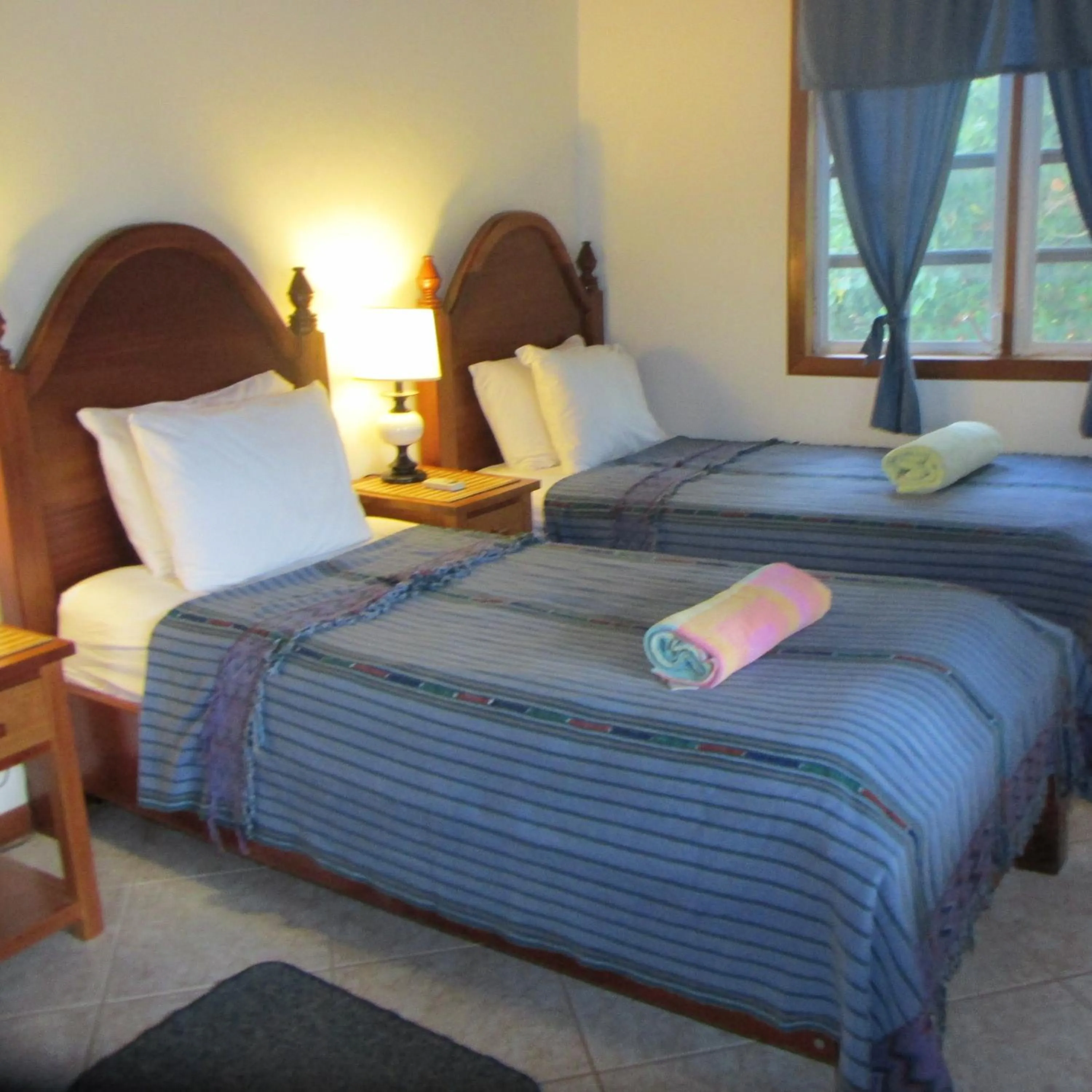 Bed in Cocotal Inn and Cabanas