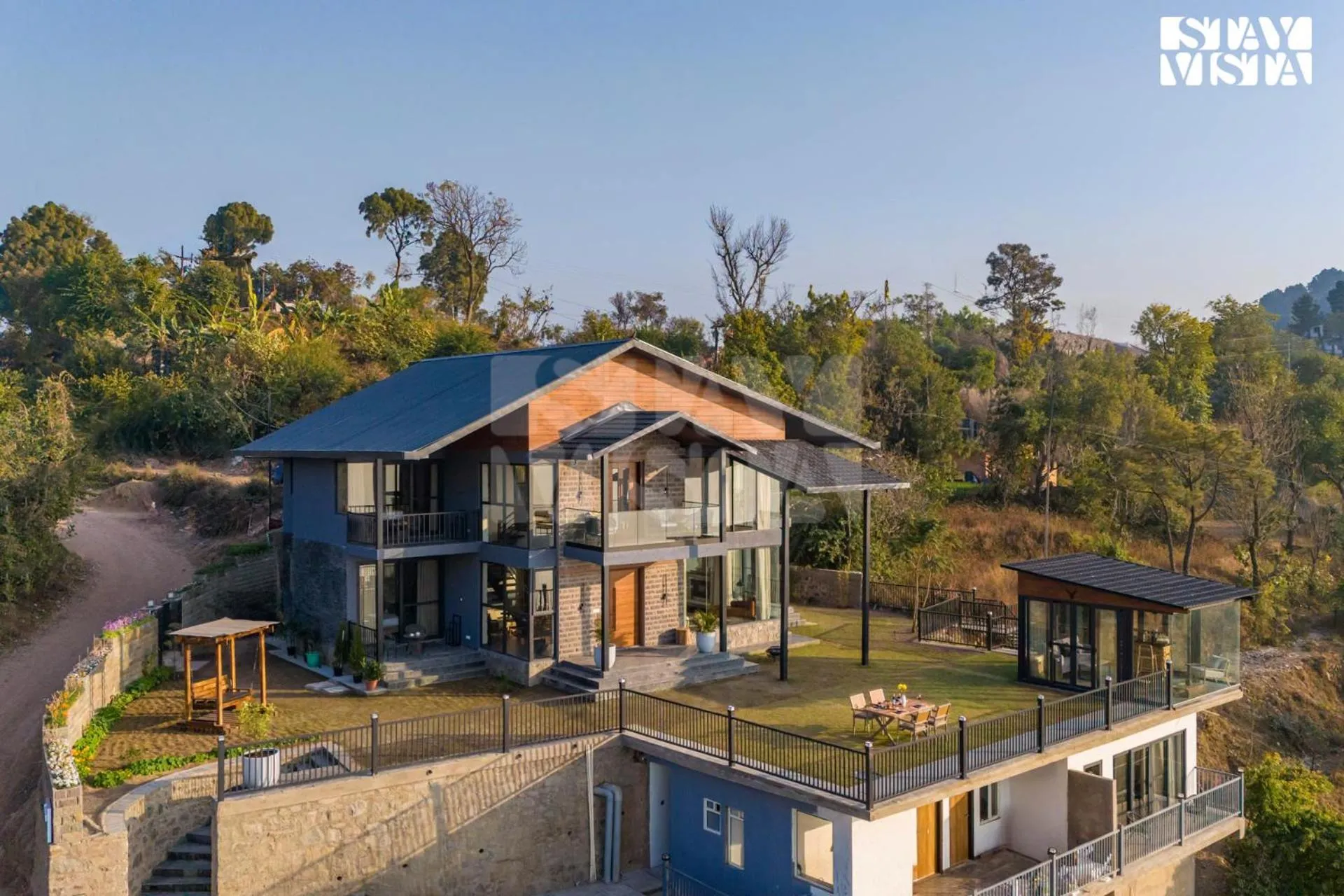 Property building in StayVista at Savara with Heated Infinity Pool and Jacuzzi