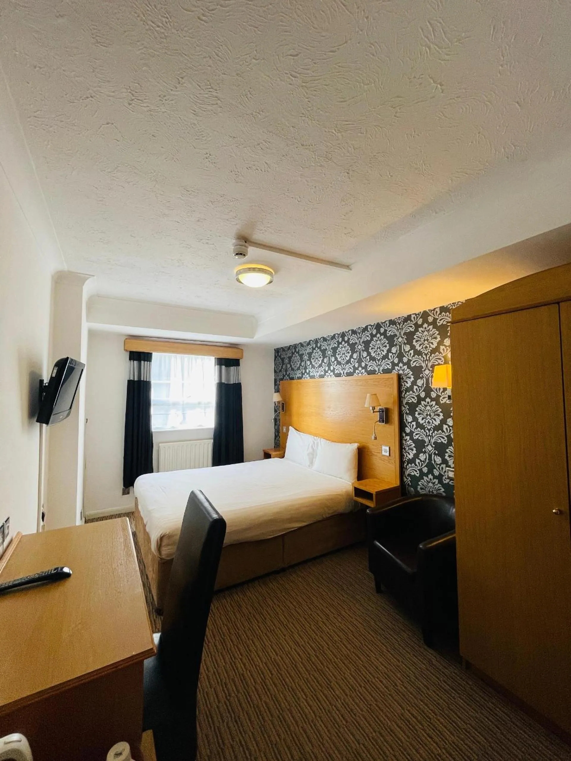 Bed in Westone Manor Hotel