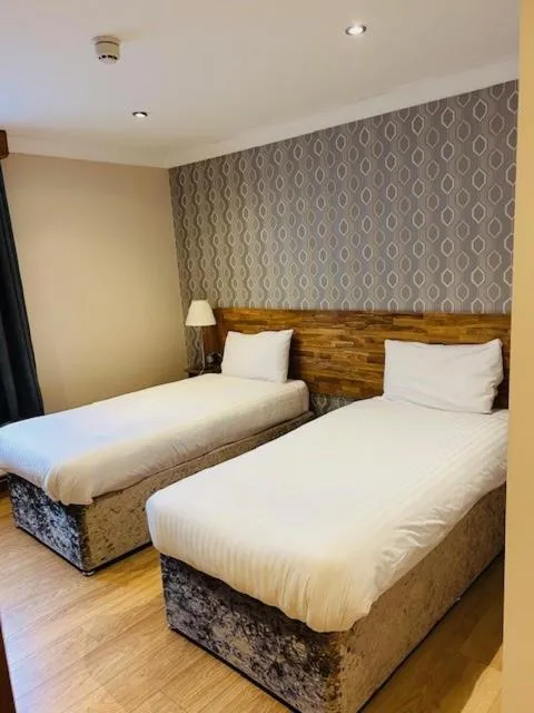 Bed in Westone Manor Hotel