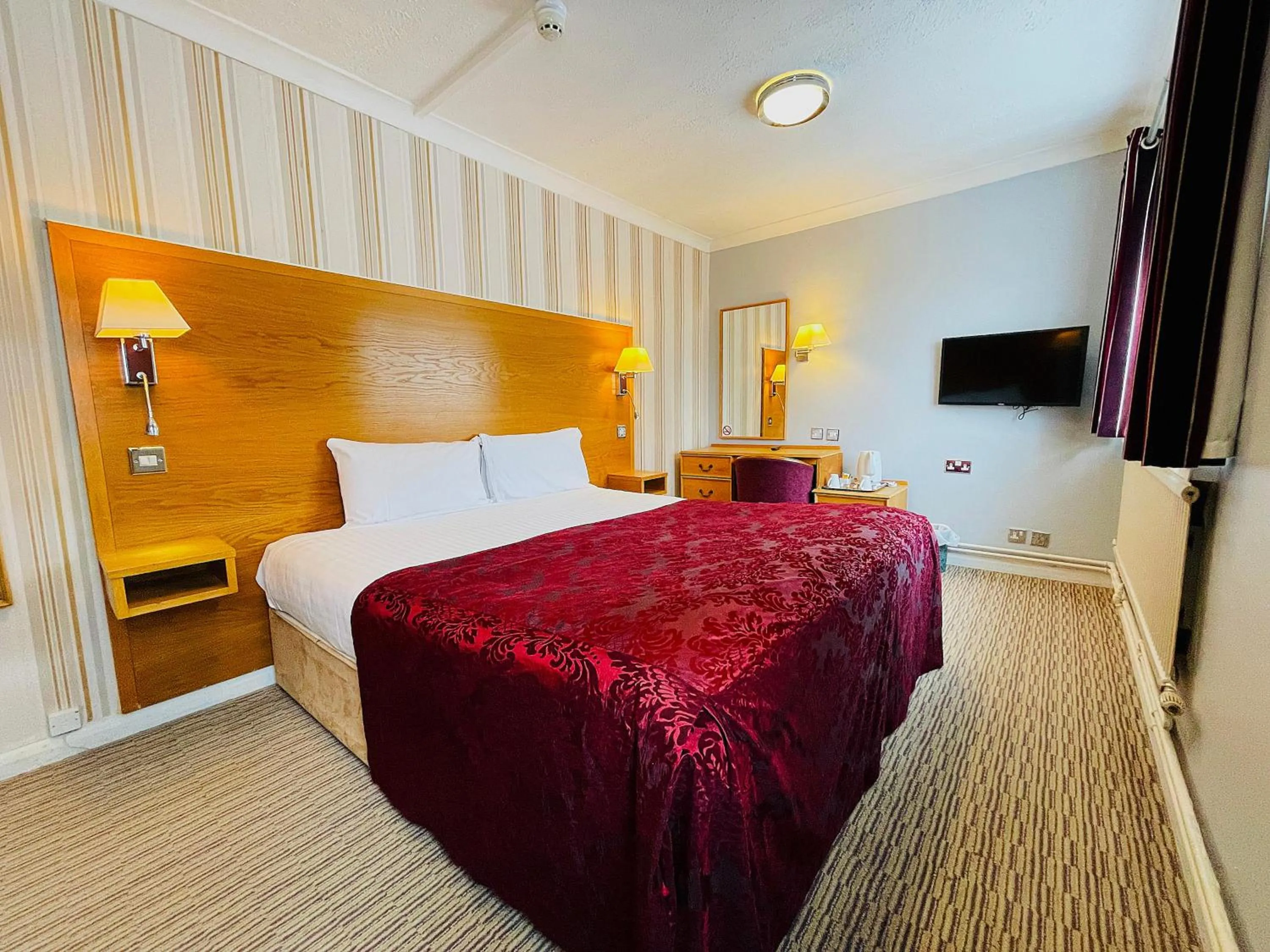 Bed in Westone Manor Hotel