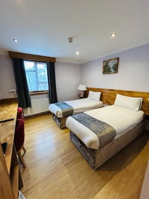 Bed in Westone Manor Hotel