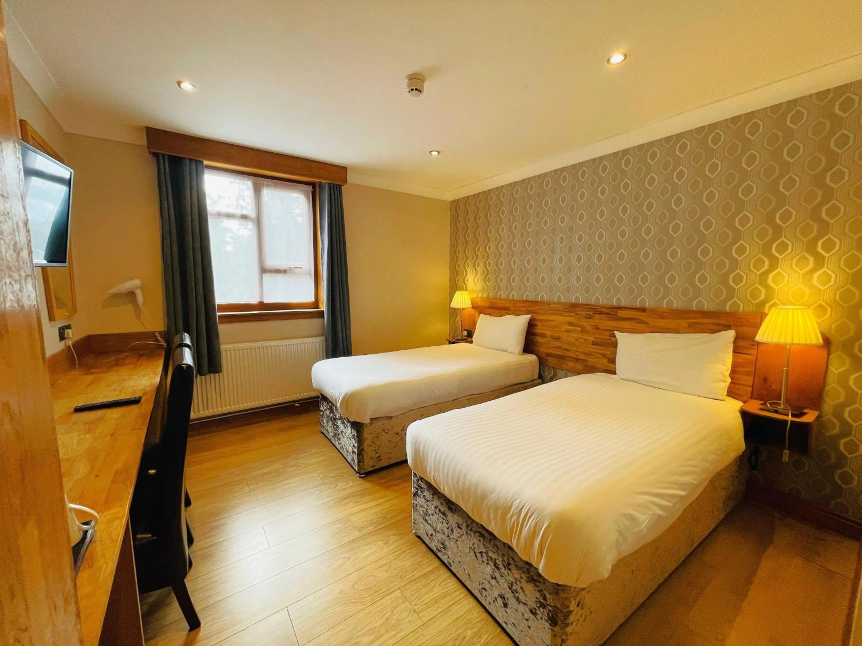 Bed in Westone Manor Hotel