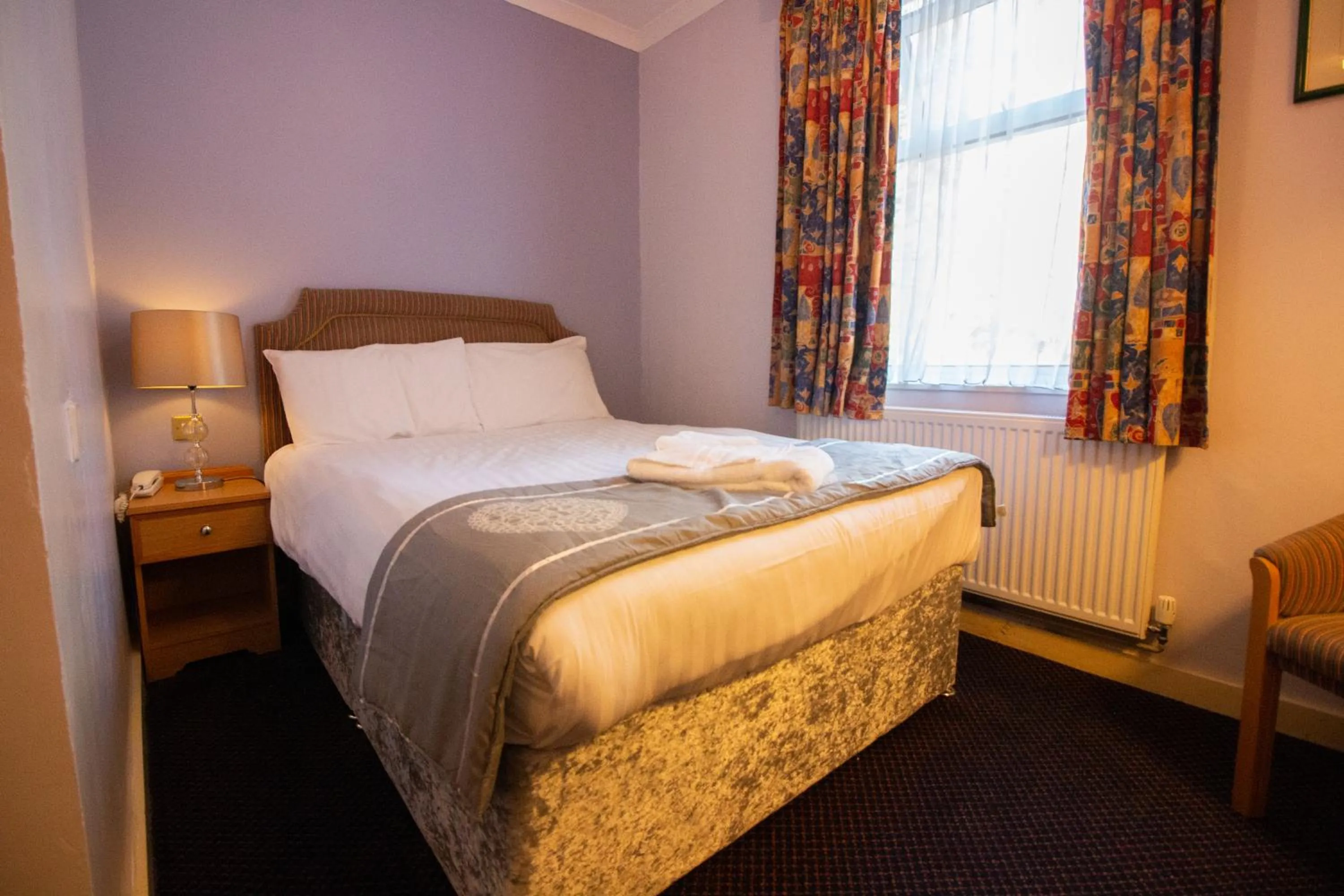 Bed in Westone Manor Hotel