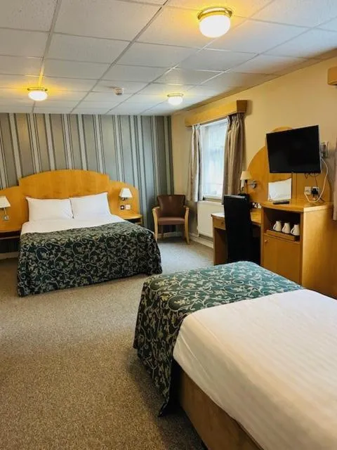 Bed in Westone Manor Hotel