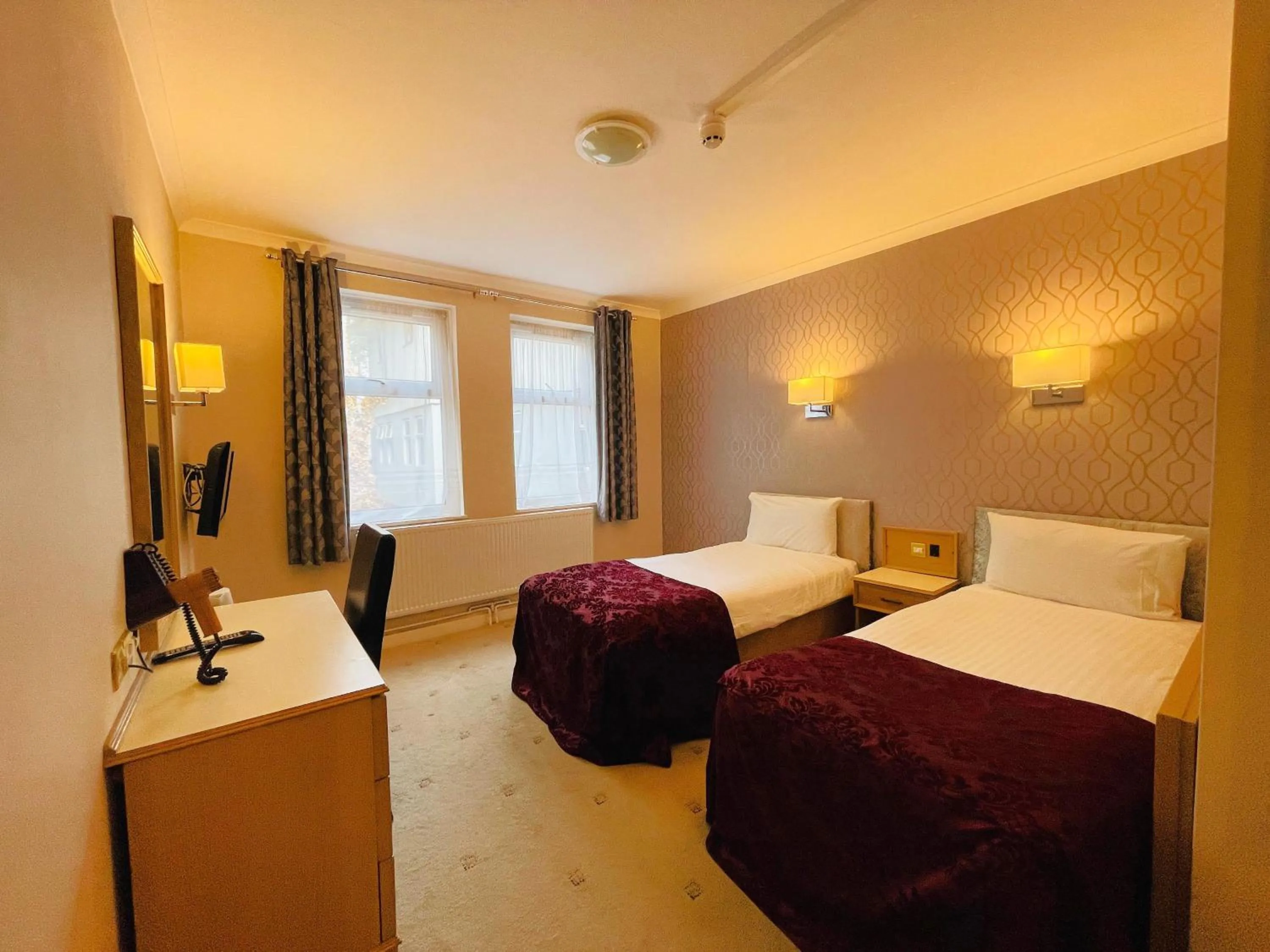 Bed in Westone Manor Hotel