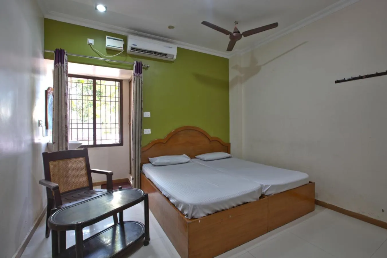 Bed in JAYA BHARATHI LODGE