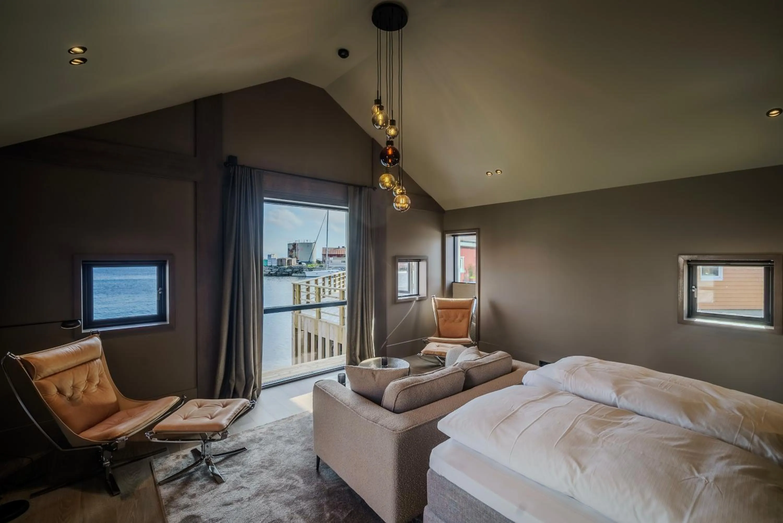 Photo of the whole room, Bed in Henningsvær Bryggehotell - by Classic Norway Hotels