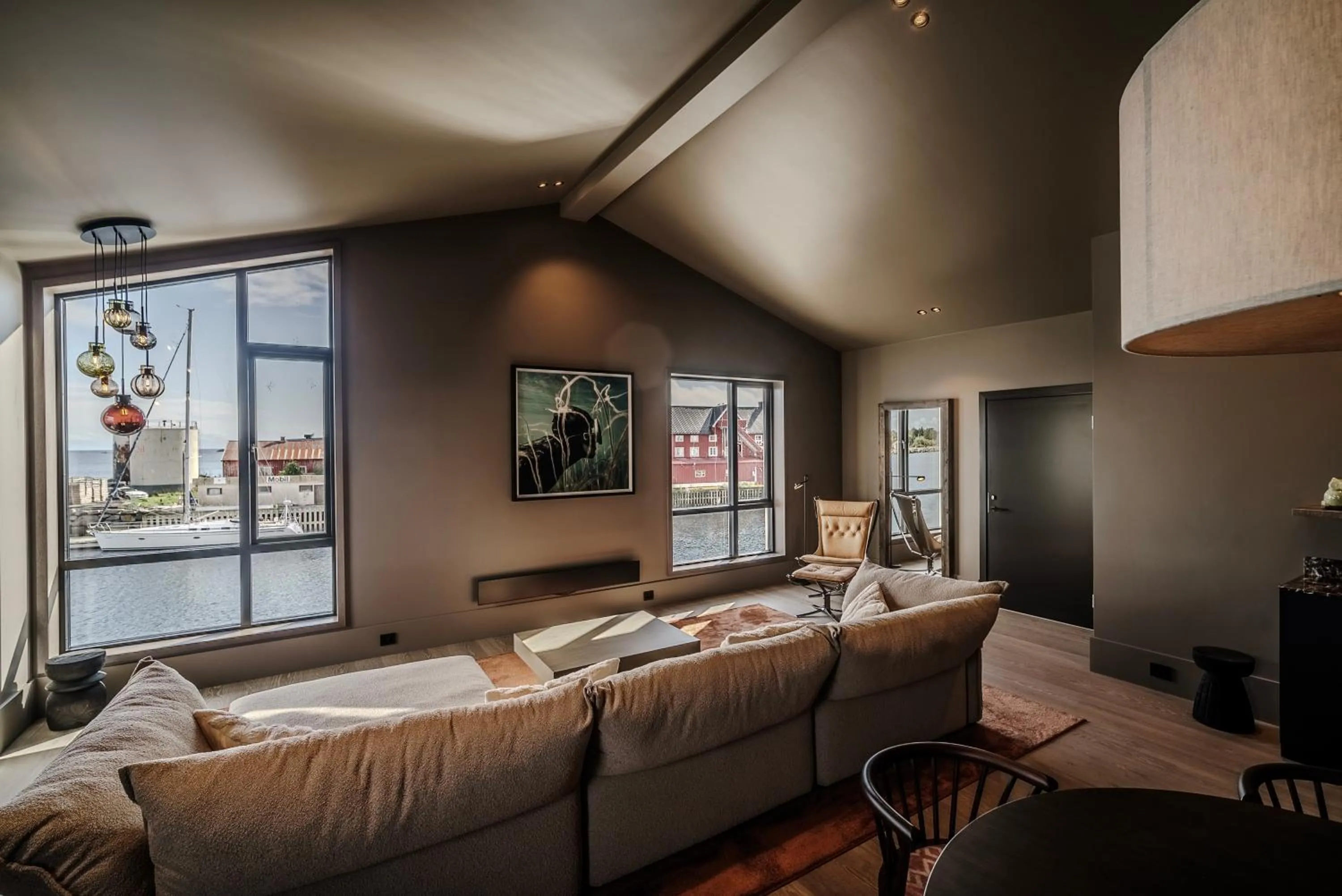 Living room, Bed in Henningsvær Bryggehotell - by Classic Norway Hotels